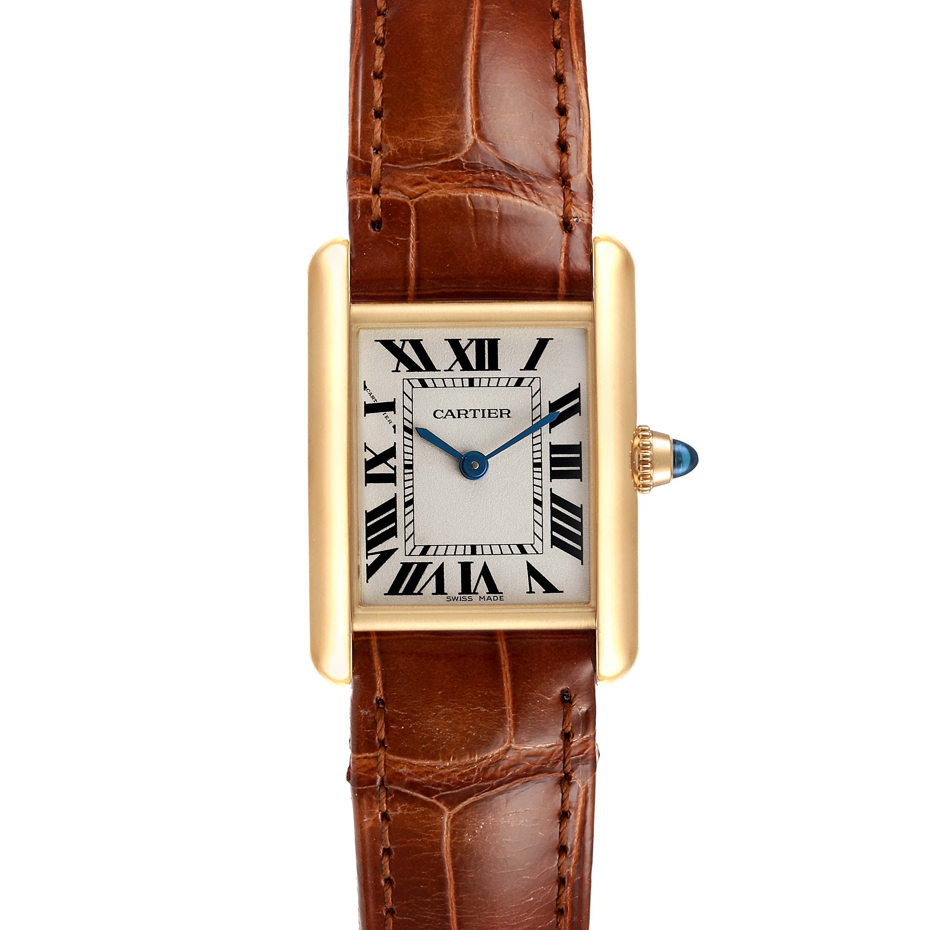 The image shows a Cartier Tank Louis W1529856 Women's Yellow Gold Silver Dial W1529856 Women's Yellow Gold Silver Dial watch from a top-down angle, displaying its face, brown leather strap, and gold case with a blue cabochon crown.