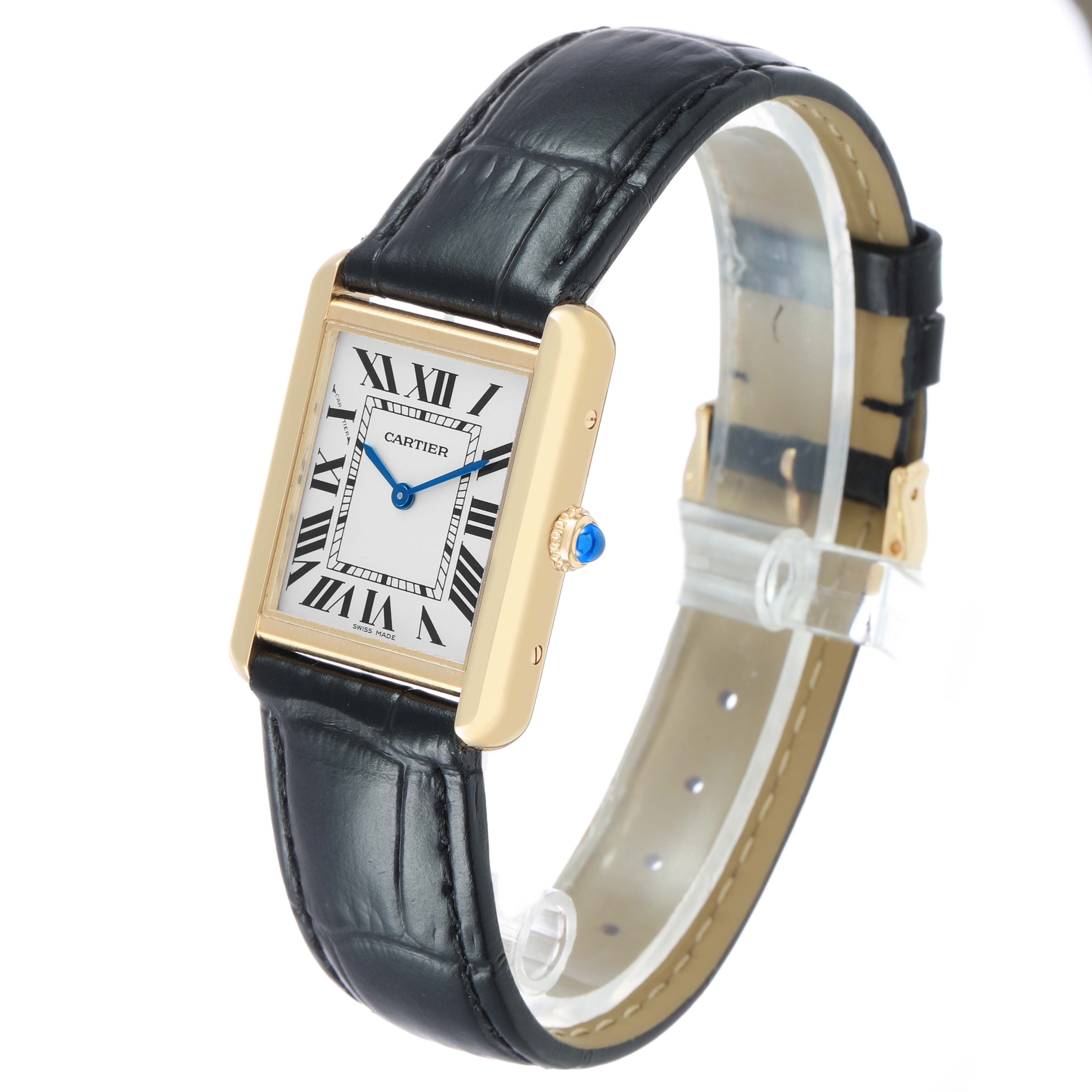 The Cartier Tank Solo W1018755 Women's Yellow Gold Silver Dial watch is shown at a slight angle, displaying its face, crown, and black leather strap.