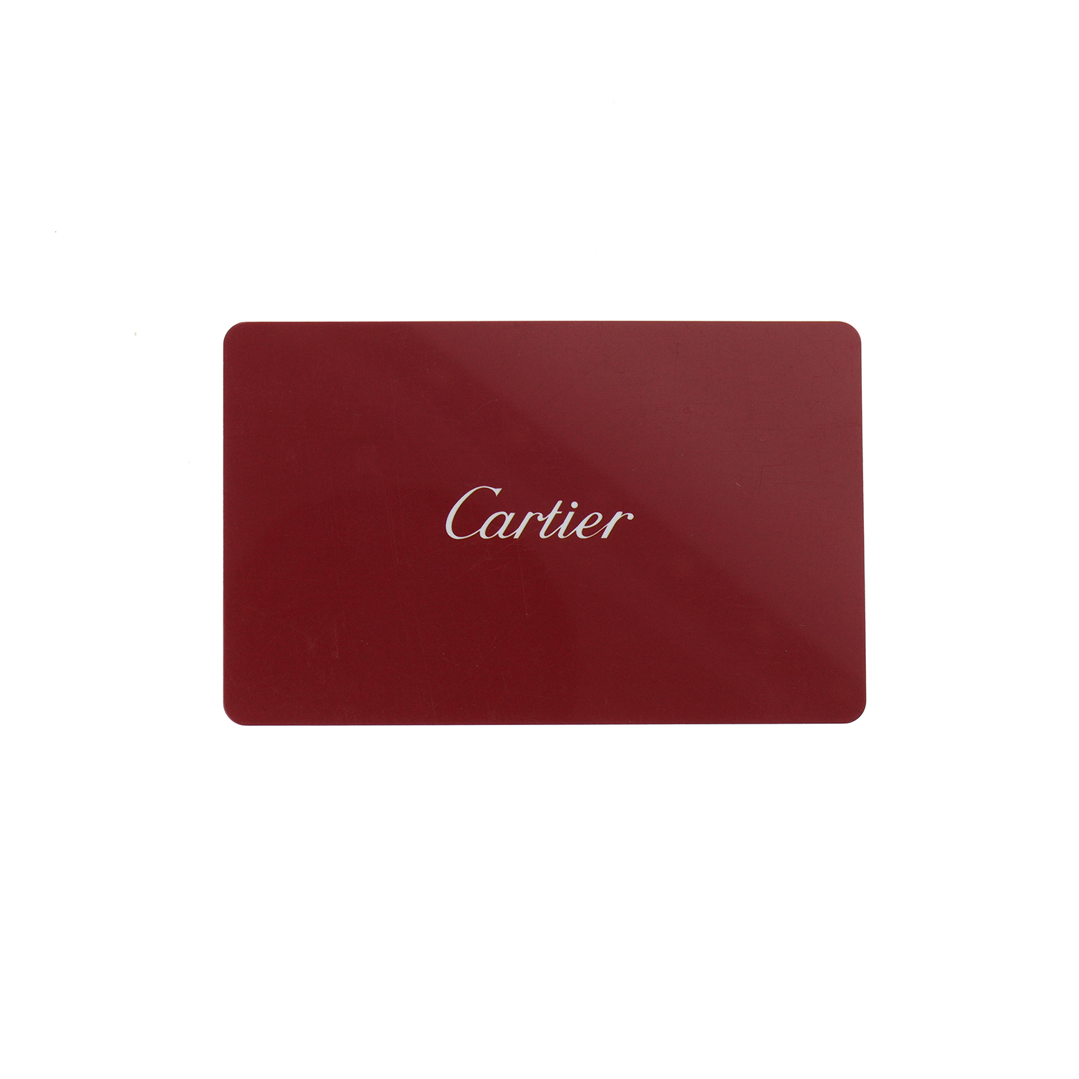 The image shows a red Cartier card, likely an accessory for the Tank Solo model.