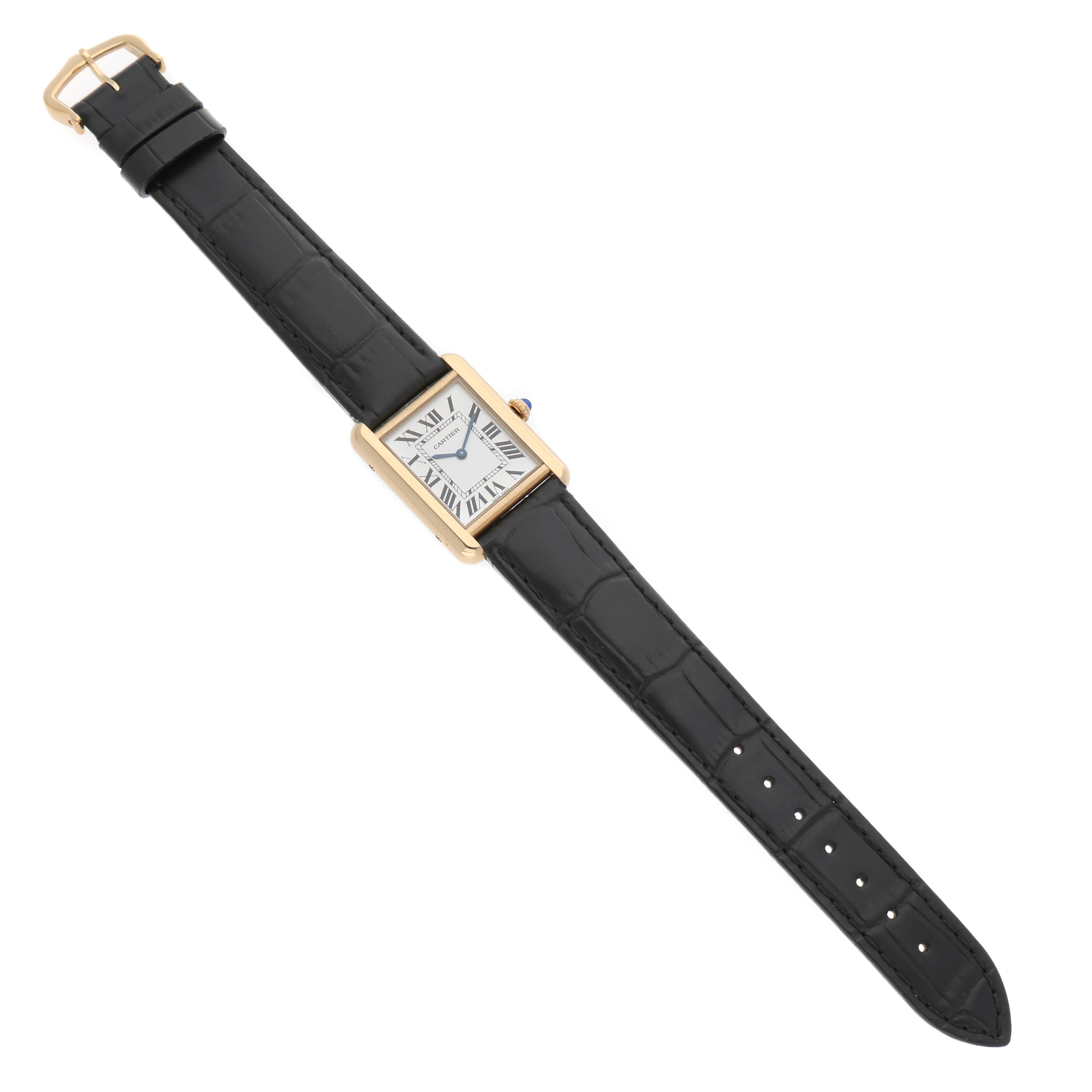 The Cartier Tank Solo W1018755 Women's Yellow Gold Silver Dial watch is shown from a top-down angle, displaying the face, case, and full leather strap.