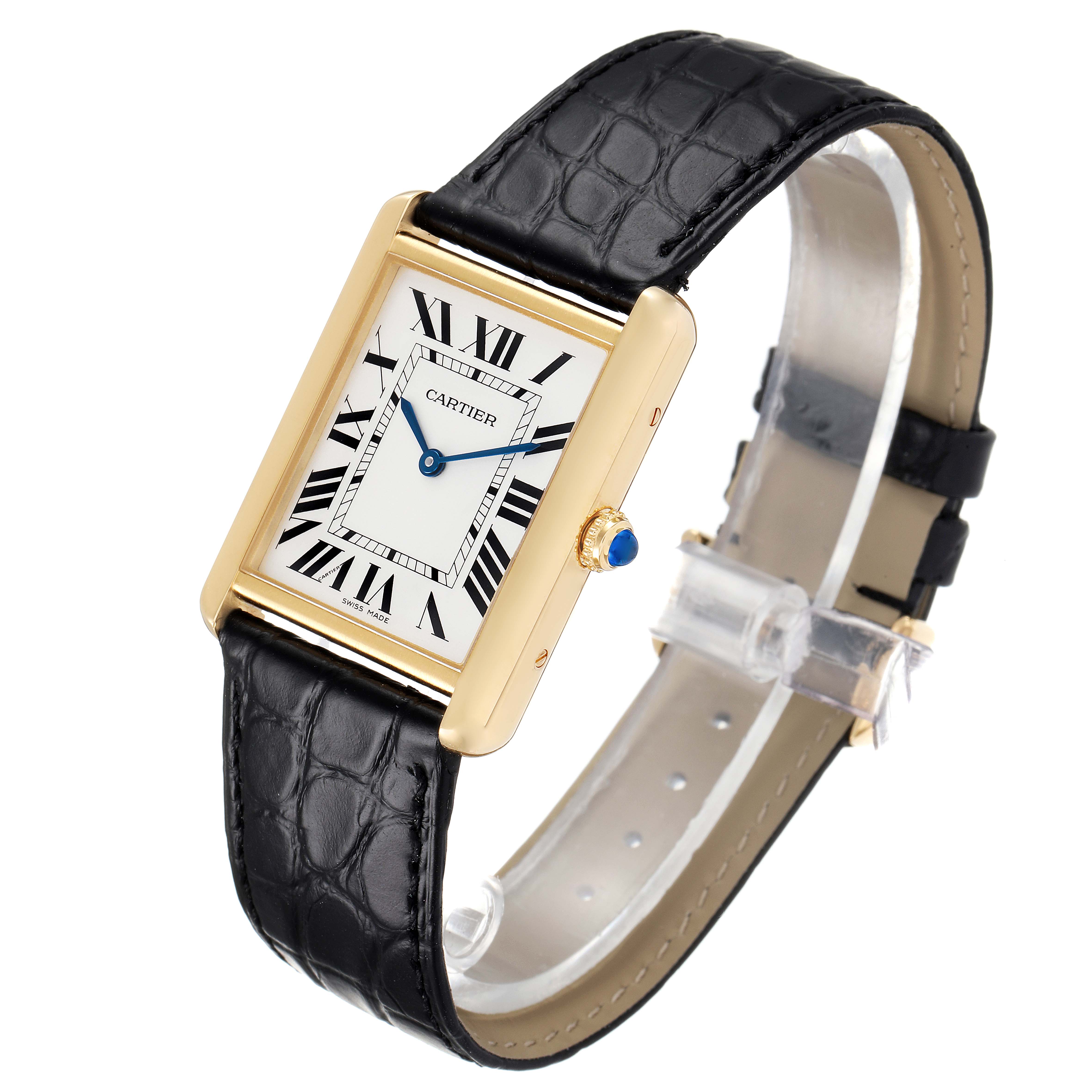 The Tank Solo by Cartier is shown at a slight angle, displaying the face, gold case, black leather strap, and blue crown.