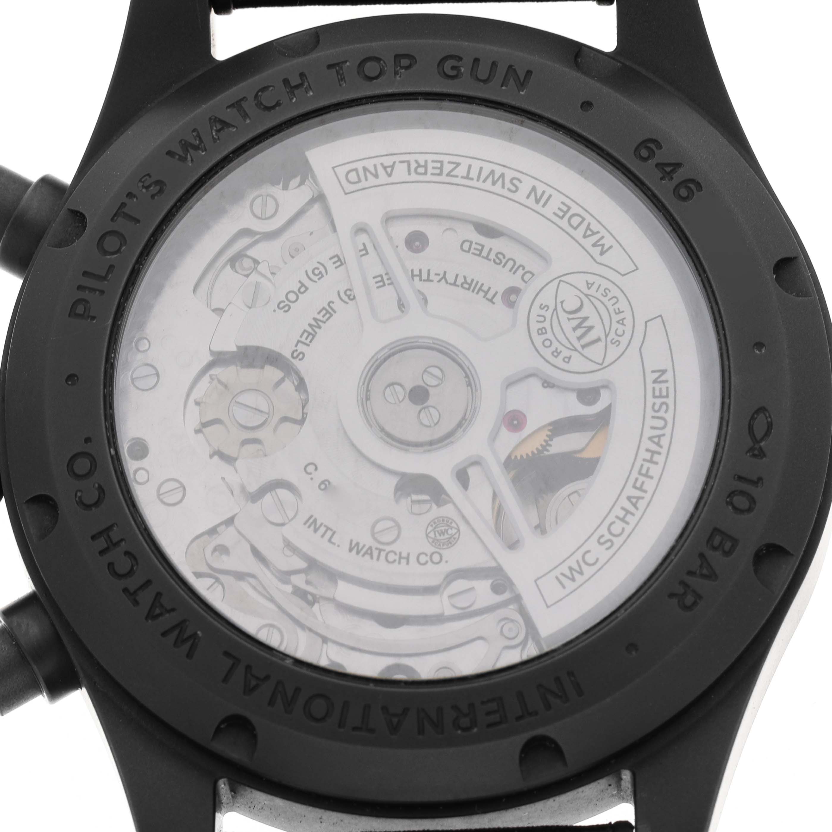 The image shows the back view of the IWC Pilot IW388106 Men's Titanium Black Dial's Watch, displaying its movement and inner mechanism.