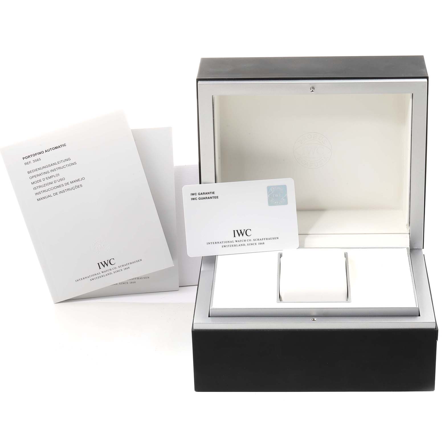 This image shows the IWC Portofino IW356502 Men
s Stainless Steel Silver Dial IW356502 Men
s Stainless Steel Silver Dial watch box, the guarantee card, and operating instructions booklets.