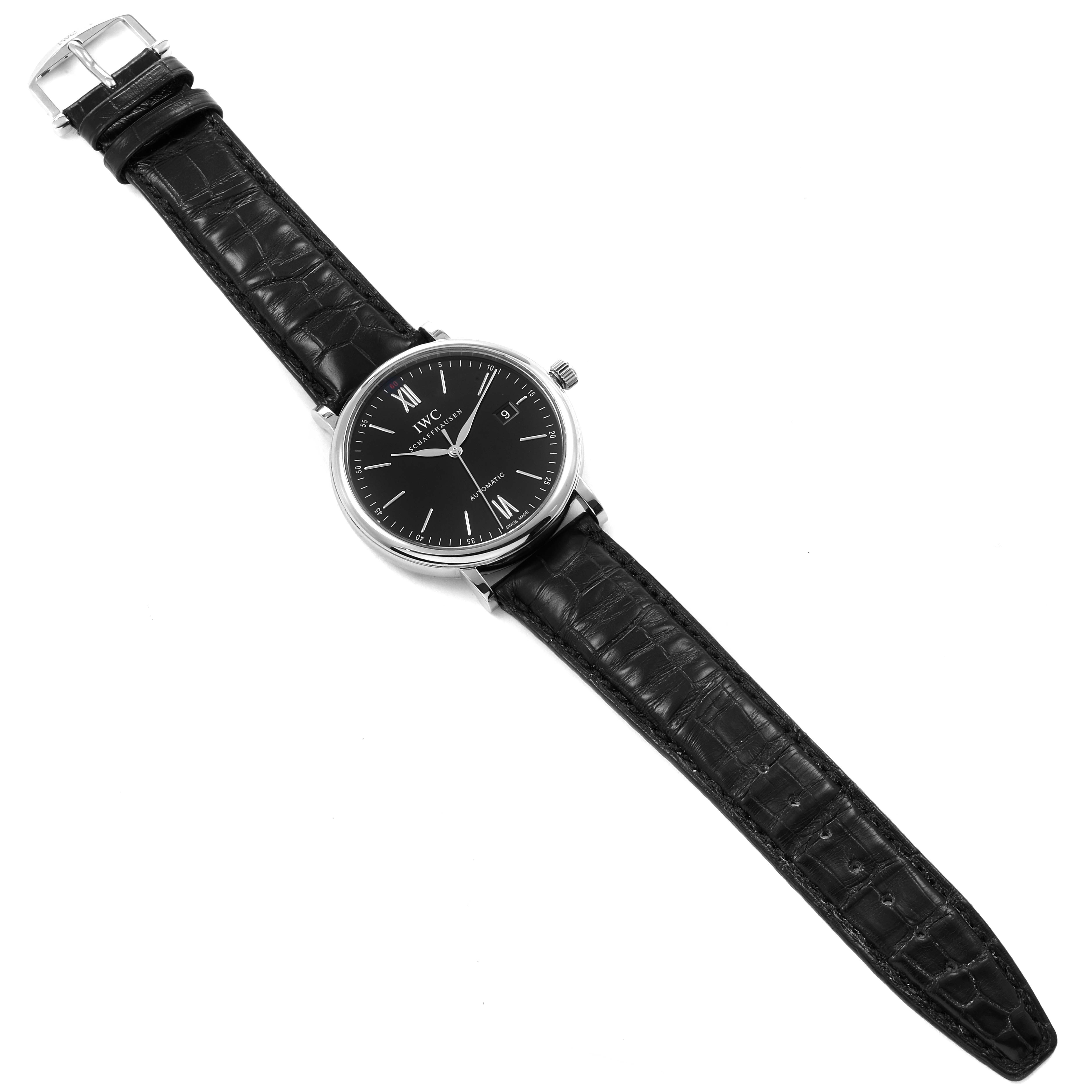 The IWC Portofino IW356502 Men
s Stainless Steel Silver Dial IW356502 Men
s Stainless Steel Silver Dial watch is shown from a top-down angle, highlighting the black leather strap and the black dial with silver markers.