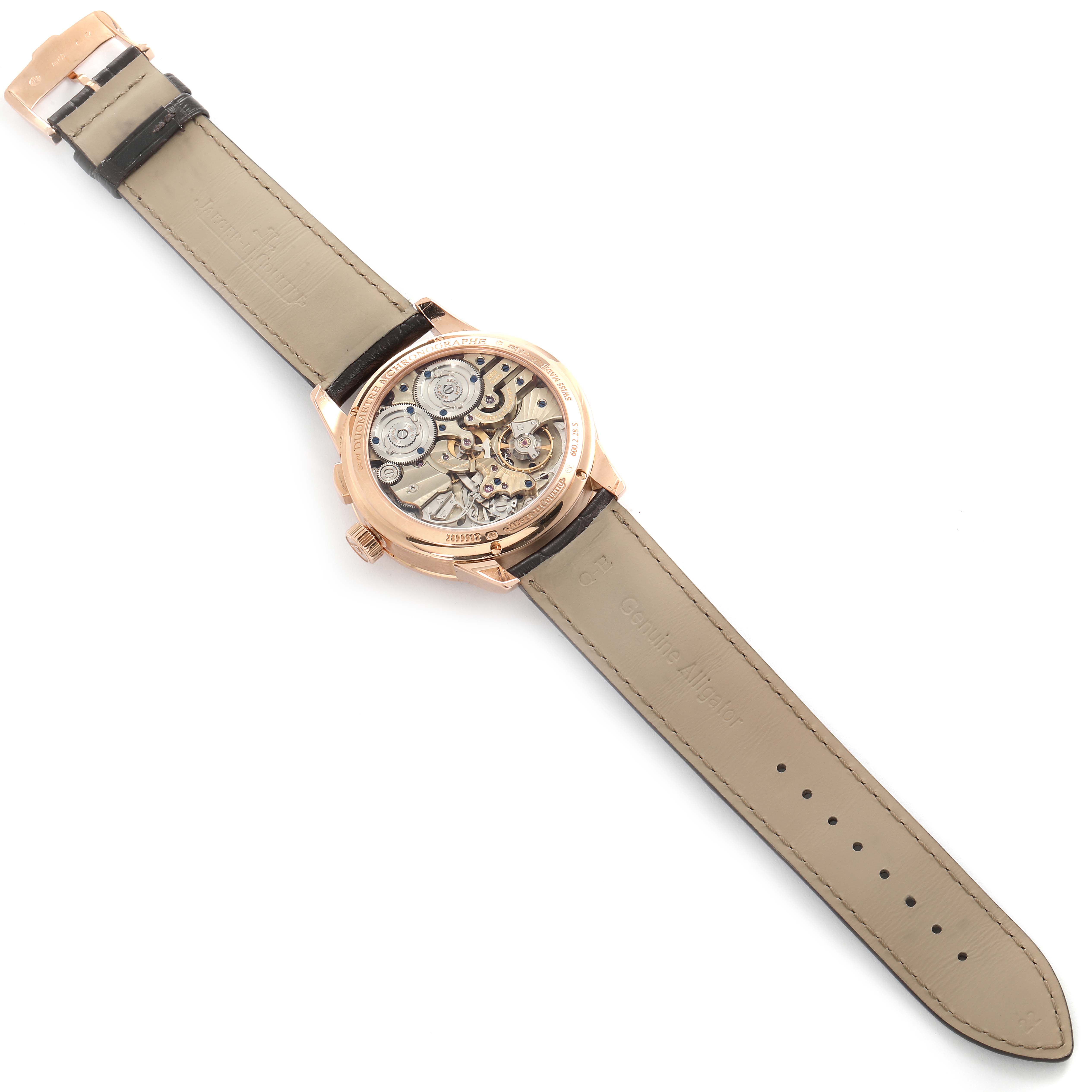 The image shows the back view of a Jaeger-LeCoultre Duomètre watch, revealing its intricate movement and the leather strap.