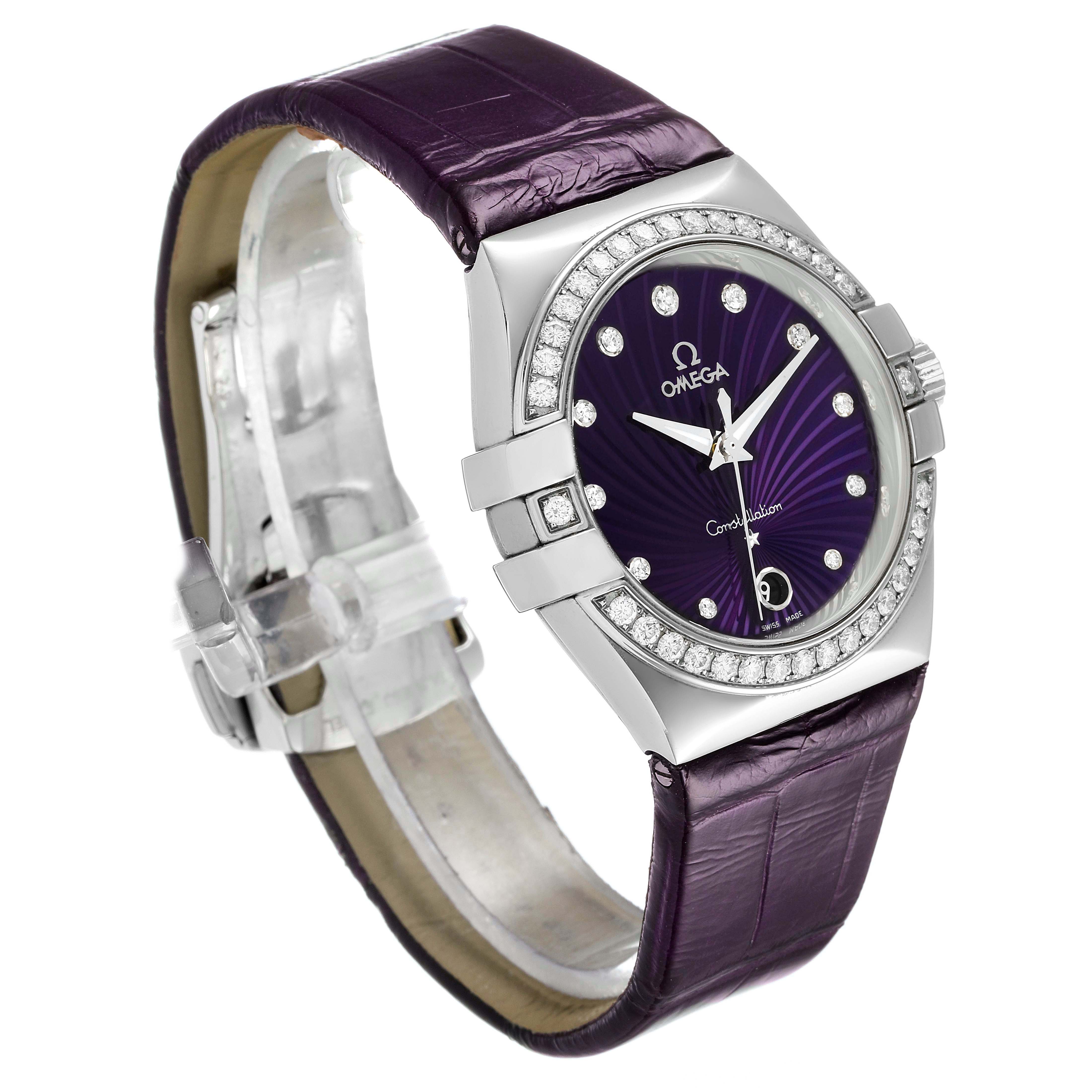 The image shows an angled view of the dial and strap of the Omega 123.18.35.60.60.001 Women's Stainless Steel Purple Dial 123.18.35.60.60.001 Women's Stainless Steel Purple Dial Constellation 35mm Diamond Steel Ladies Watch model 123.18.35.60.60.001.