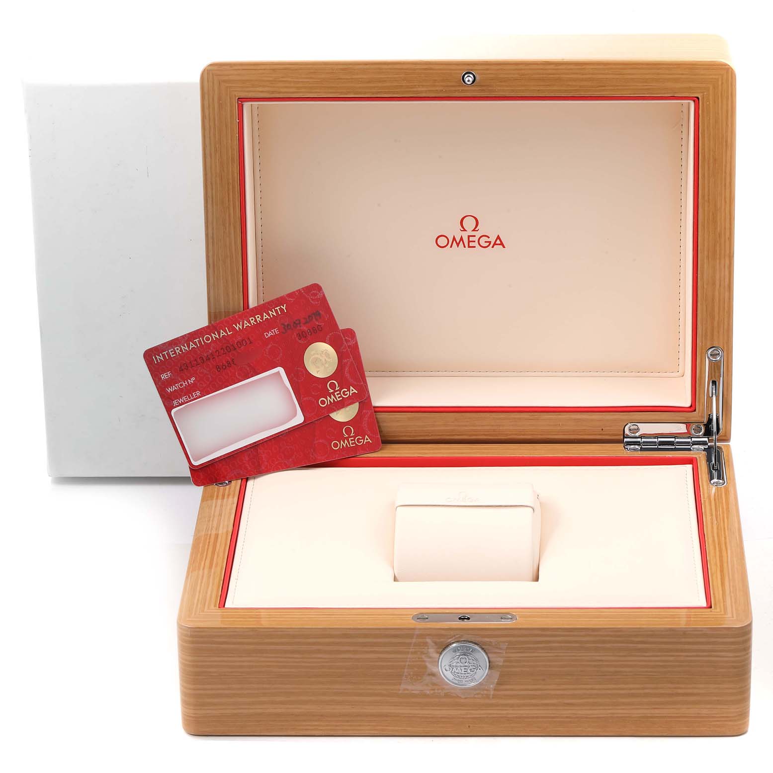 This image shows the open box of an Omega De Ville 431.10.41.22.01.001 Men
s Stainless Steel Black Dial 431.10.41.22.01.001 Men
s Stainless Steel Black Dial watch accompanied by an international warranty card.