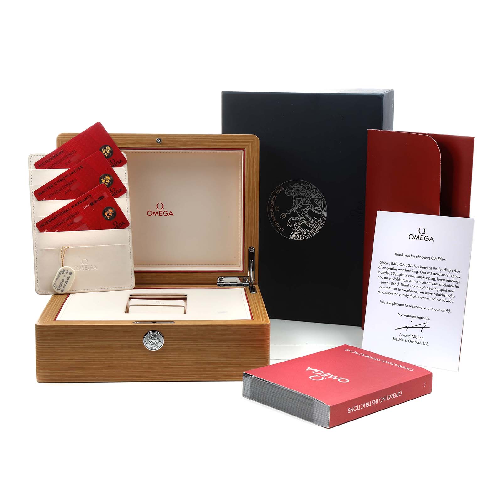 The image shows the Omega Seamaster 210.30.42.20.03.003 Men's Stainless Steel Blue Dial watch box, warranty cards, instruction book, and welcome letter from an overhead angle.