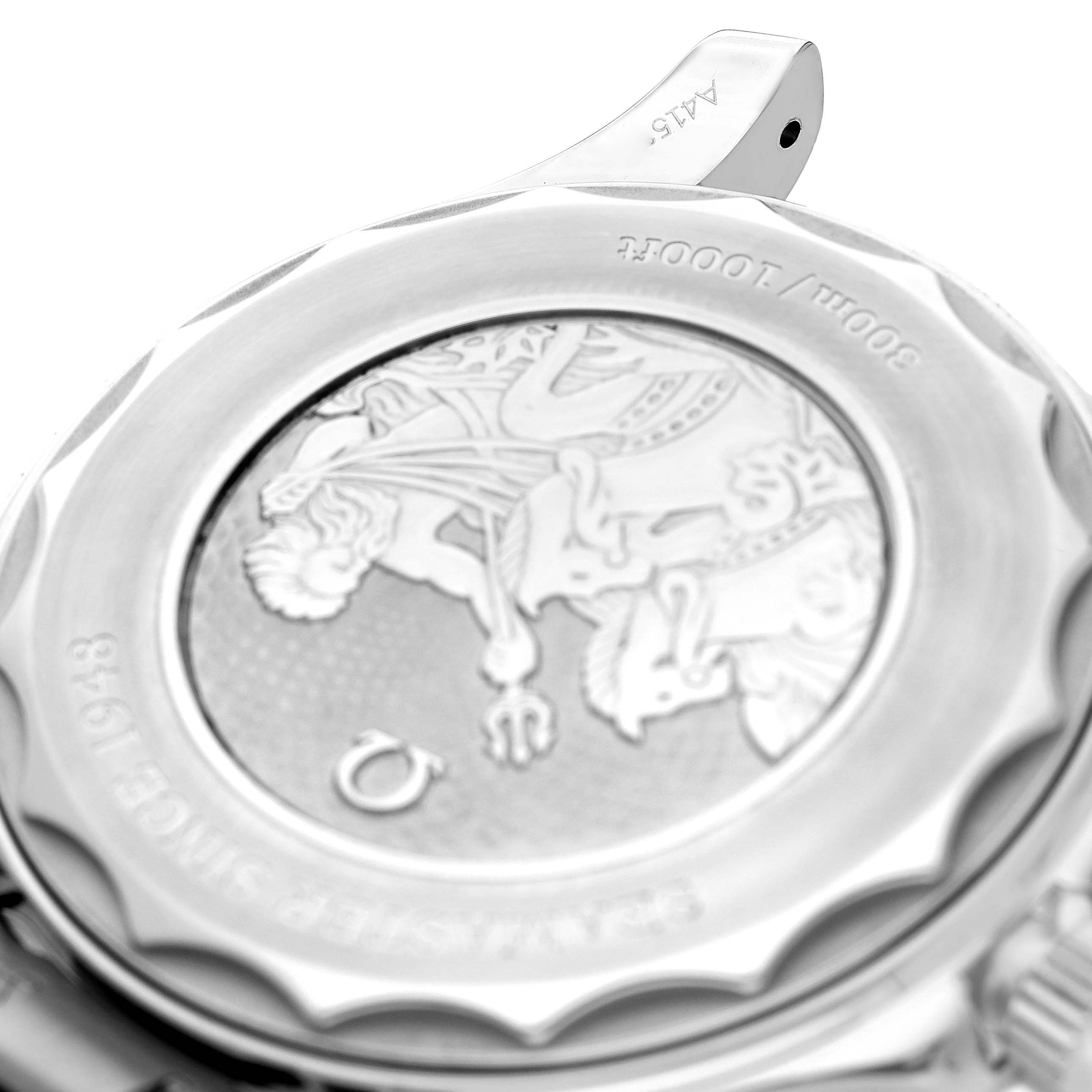 The image shows the case back of an Omega Seamaster 210.30.42.20.03.003 Men's Stainless Steel Blue Dial model, featuring a detailed engraving with parts of the bezel visible.