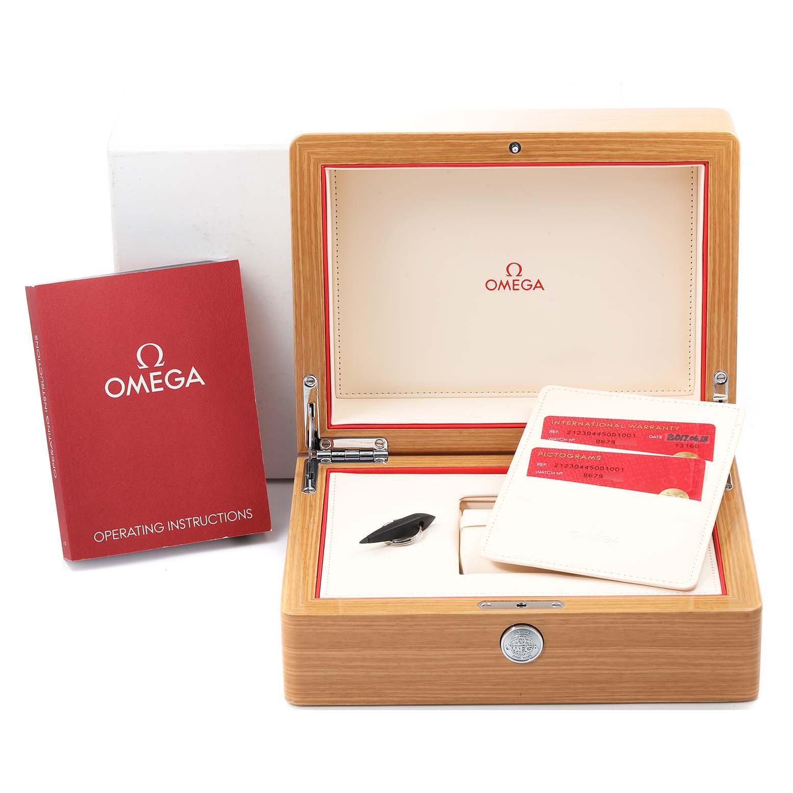 The image shows an Omega Seamaster 212.30.44.50.01.001 Men
s Stainless Steel Black Dial 212.30.44.50.01.001 Men
s Stainless Steel Black Dial watch box, instruction manual, and warranty cards from a front angle.