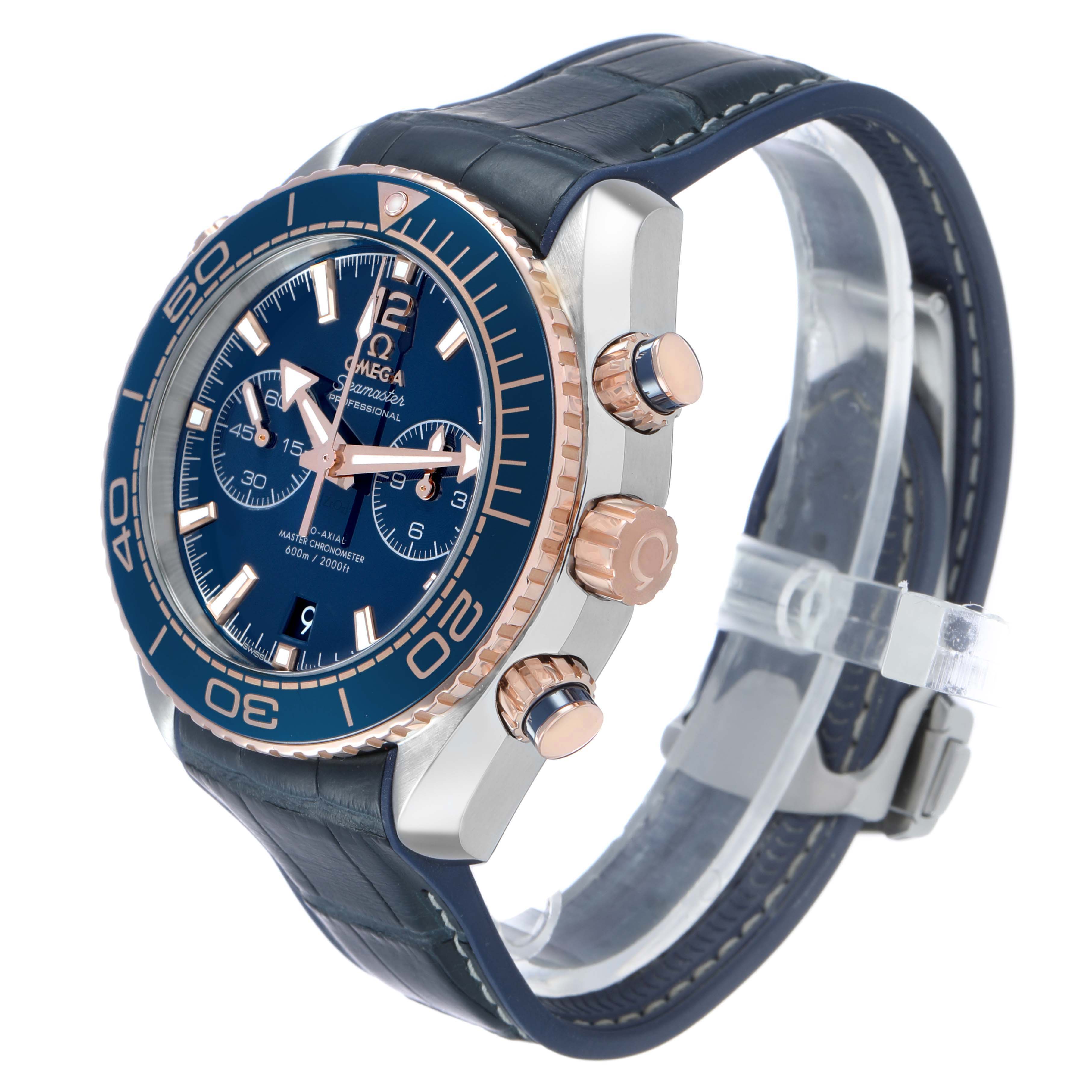 The Omega Planet Ocean 215.23.46.51.03.001 Men's Steel and Gold (two tone) Blue Dial watch is shown at an angle highlighting the face, side buttons, and strap.