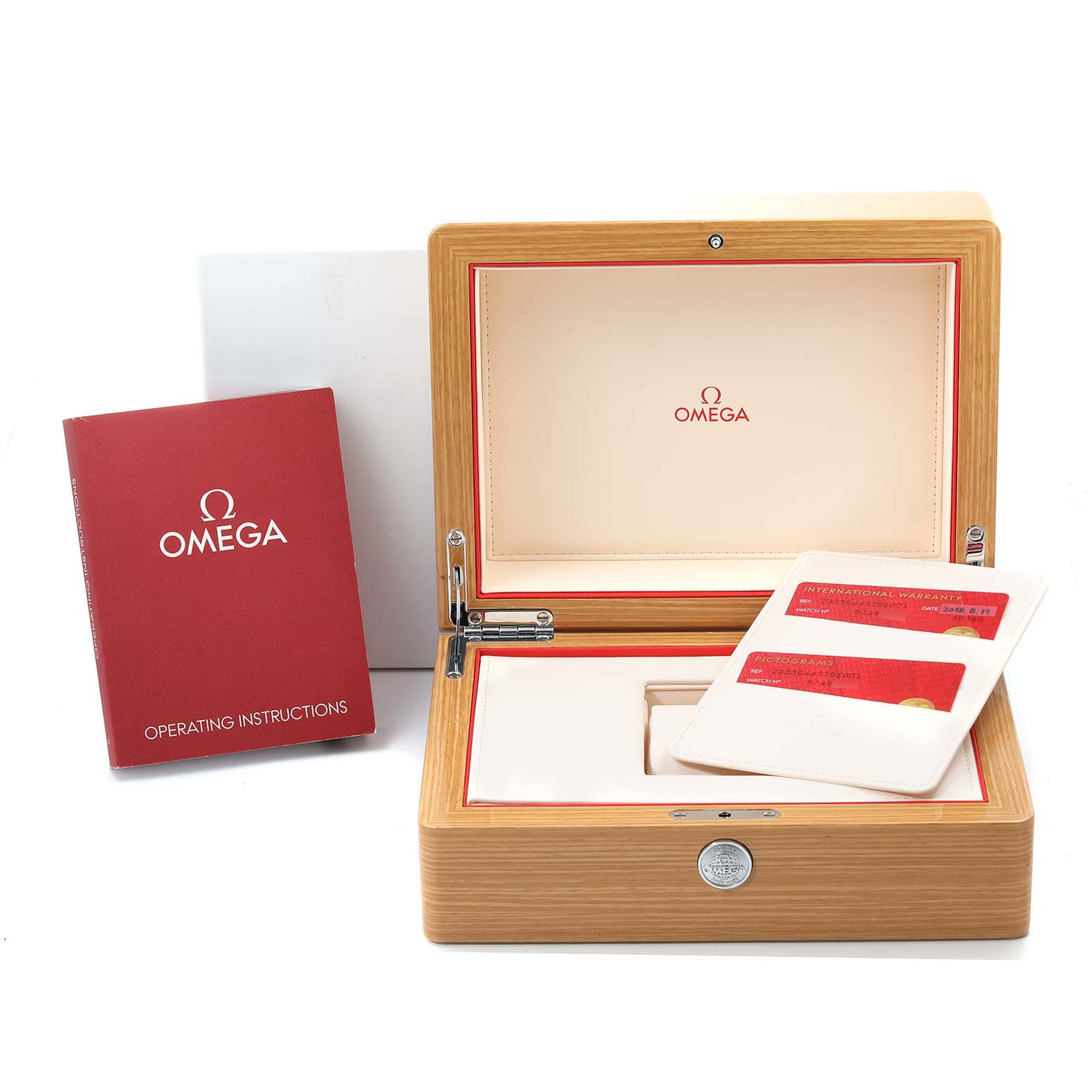 The image shows an open Omega Planet Ocean 232.30.44.22.01.001 Men
s Stainless Steel Black Dial 232.30.44.22.01.001 Men
s Stainless Steel Black Dial watch box, warranty cards, and the operating instructions manual.