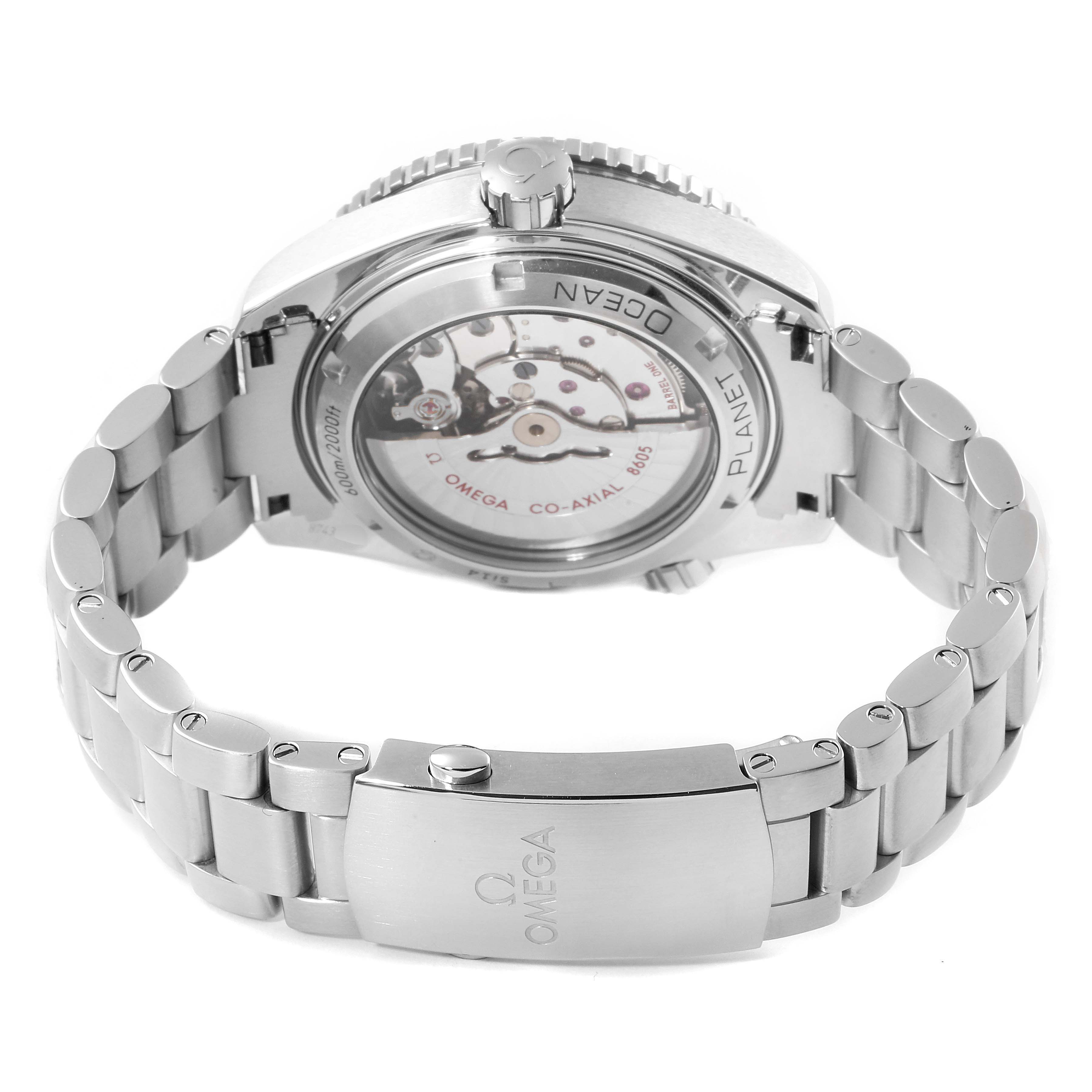 The Omega Planet Ocean 232.30.44.22.01.001 Men
s Stainless Steel Black Dial 232.30.44.22.01.001 Men
s Stainless Steel Black Dial watch is shown from the rear, revealing its transparent case back and bracelet clasp.