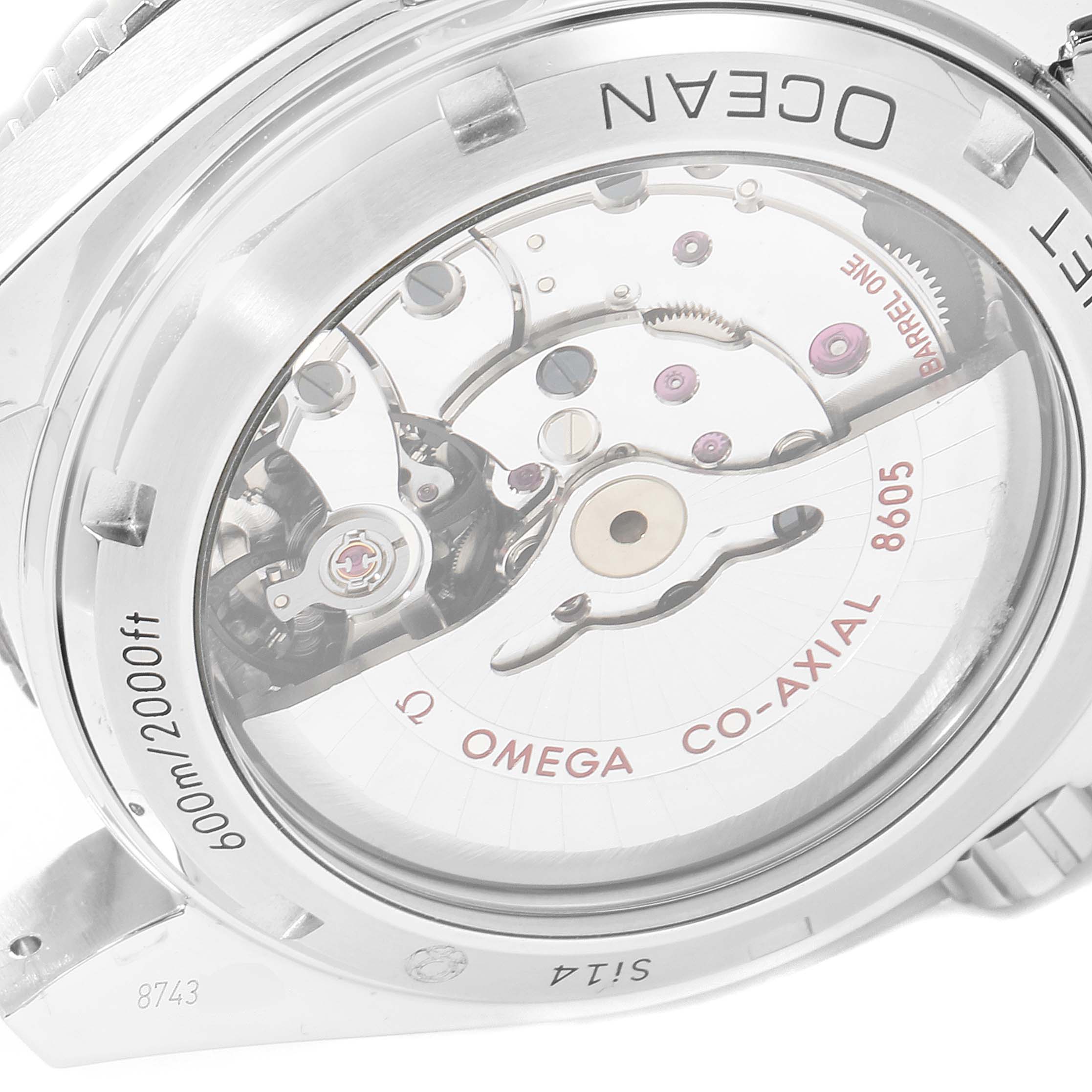 The image shows the back of an Omega Planet Ocean 232.30.44.22.01.001 Men
s Stainless Steel Black Dial 232.30.44.22.01.001 Men
s Stainless Steel Black Dial watch, highlighting its co-axial 8605 movement mechanism.