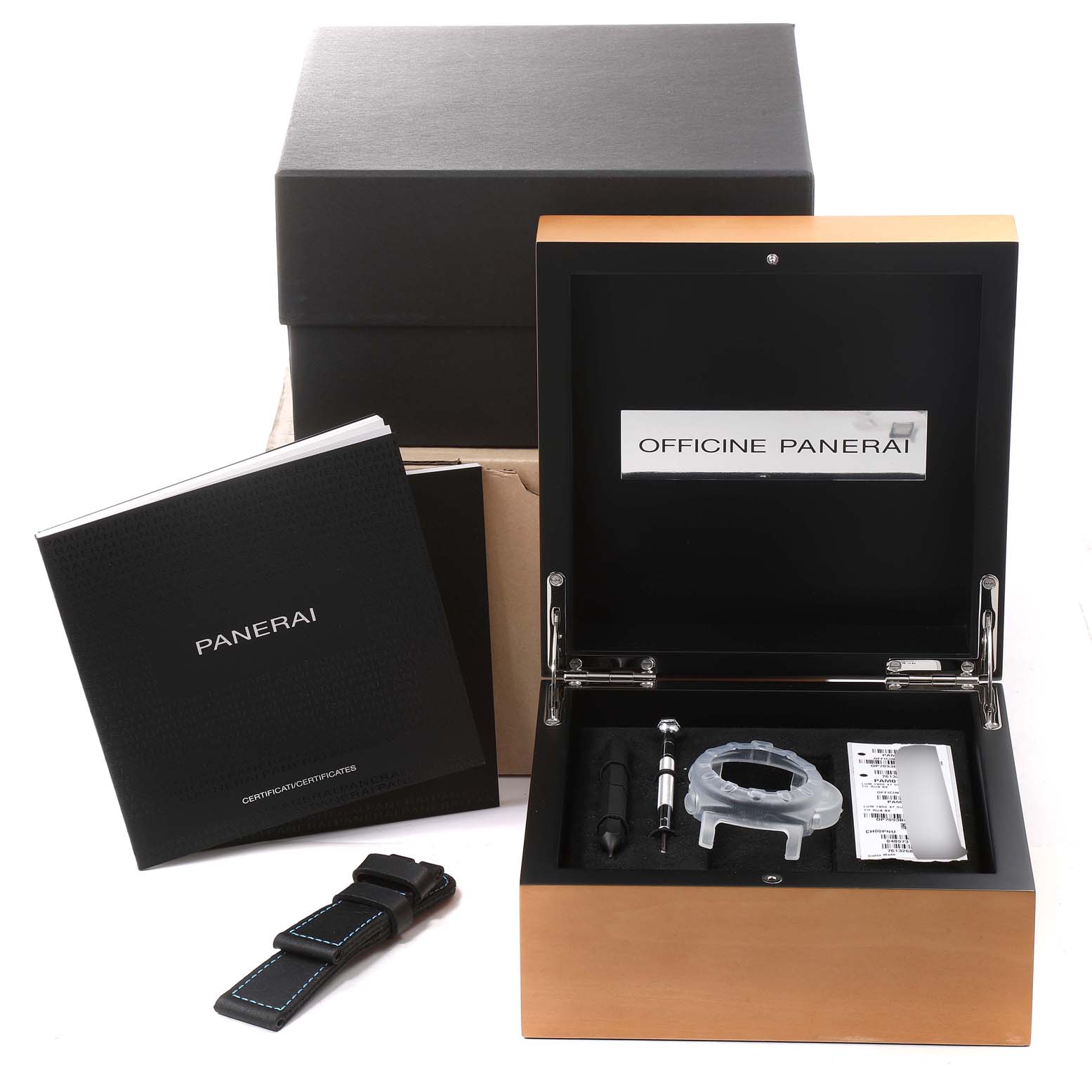 The image shows an open box for a Panerai Submersible PAM01389 Men's Titanium Black Dial PAM01389 Men's Titanium Black Dial watch, with accessories including a strap, screwdriver, and manuals.