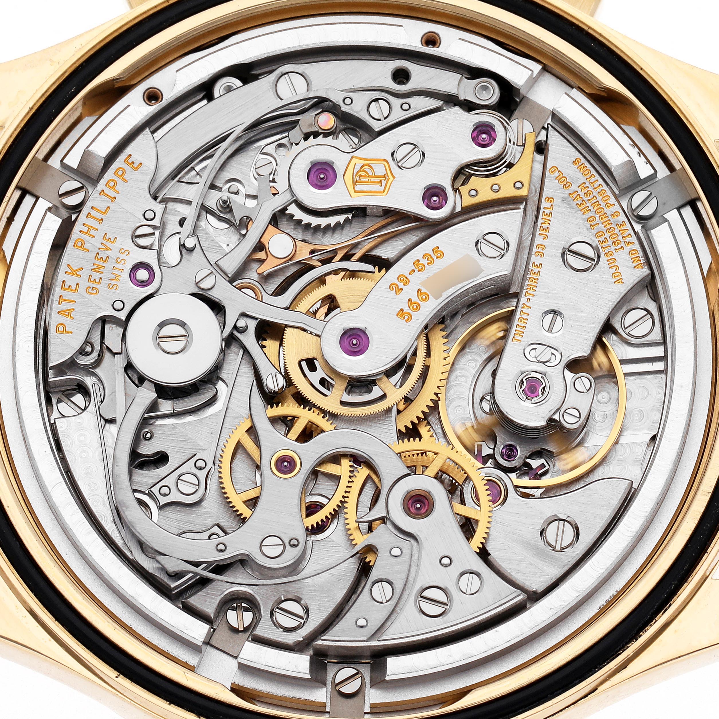 The image shows a close-up view of the intricate movement of a Patek Philippe Complications 5170J Men
s Yellow Gold Silver Dial 5170J Men
s Yellow Gold Silver Dial watch.