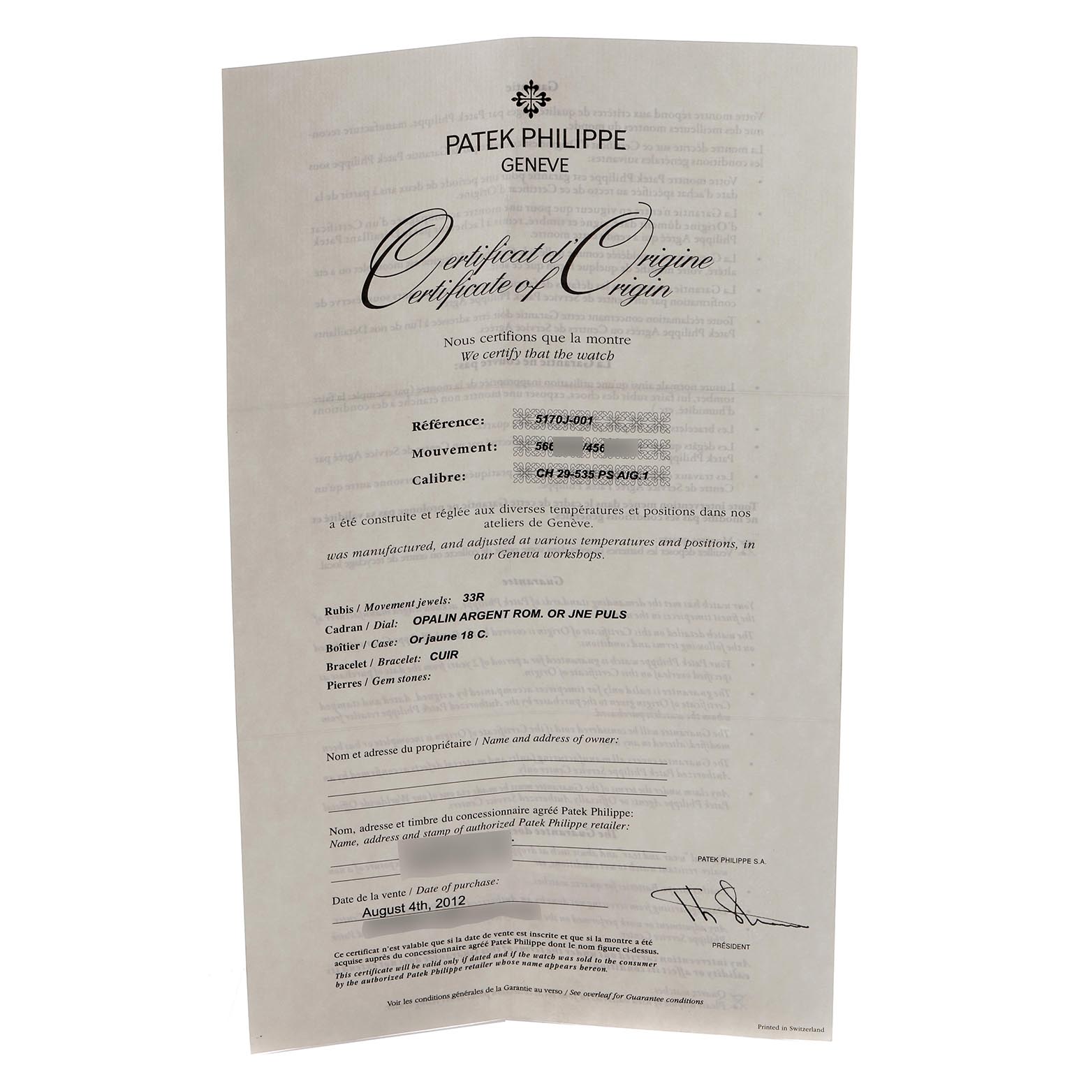 This image shows a Patek Philippe Complications 5170J Men
s Yellow Gold Silver Dial 5170J Men
s Yellow Gold Silver Dial model
s Certificate of Origin document, captured head-on.