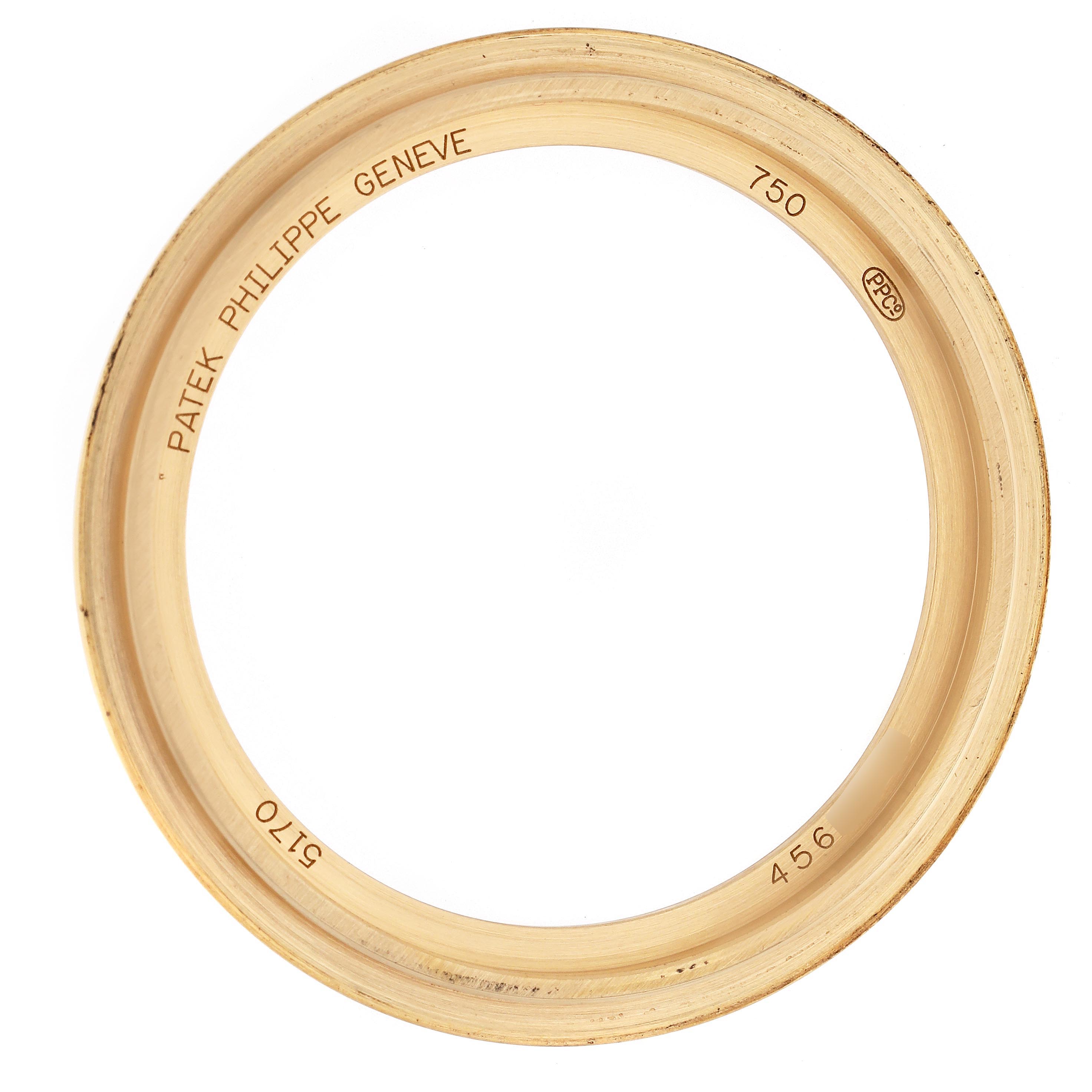 The image shows a bezel of a Patek Philippe Complications 5170J Men
s Yellow Gold Silver Dial 5170J Men
s Yellow Gold Silver Dial watch with inscriptions.