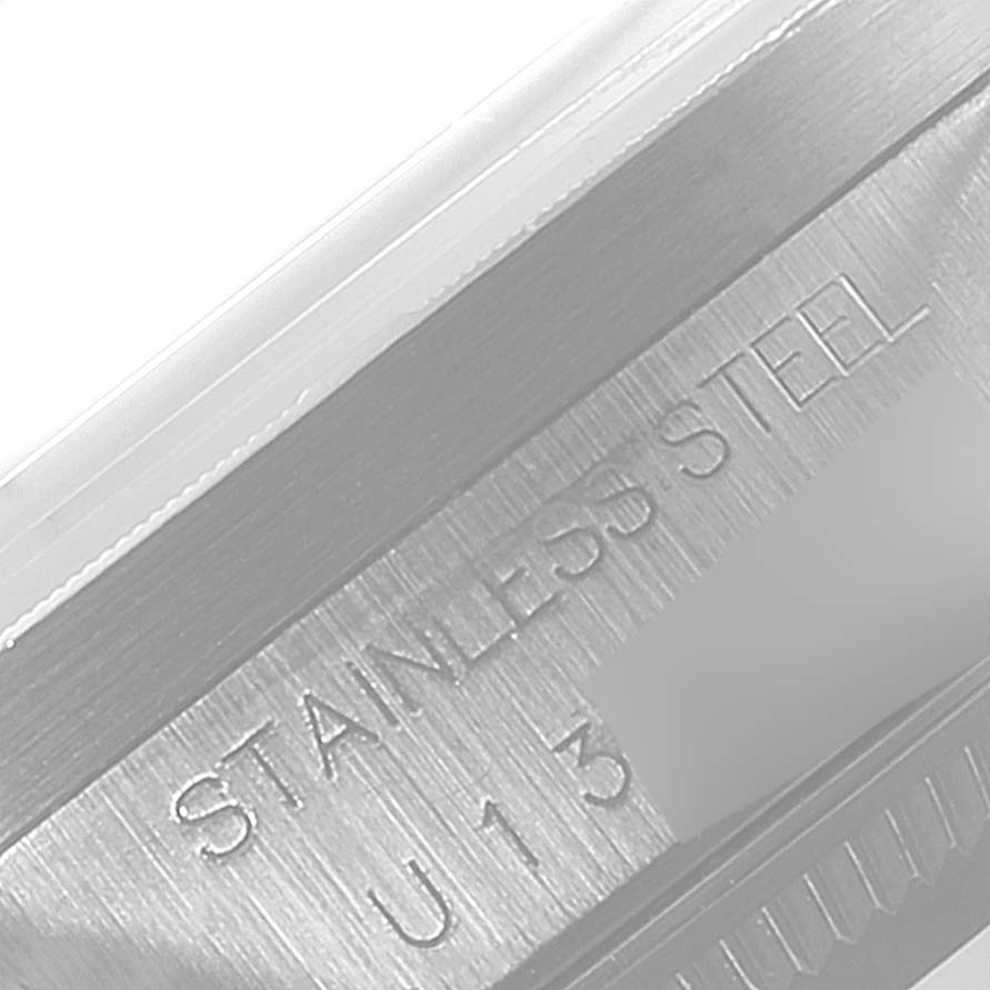 The image shows a close-up of the case back with "STAINLESS STEEL" engraved on a Rolex Air-King 14010 Men's Stainless Steel Pink Dial 14010 Men's Stainless Steel Pink Dial model.