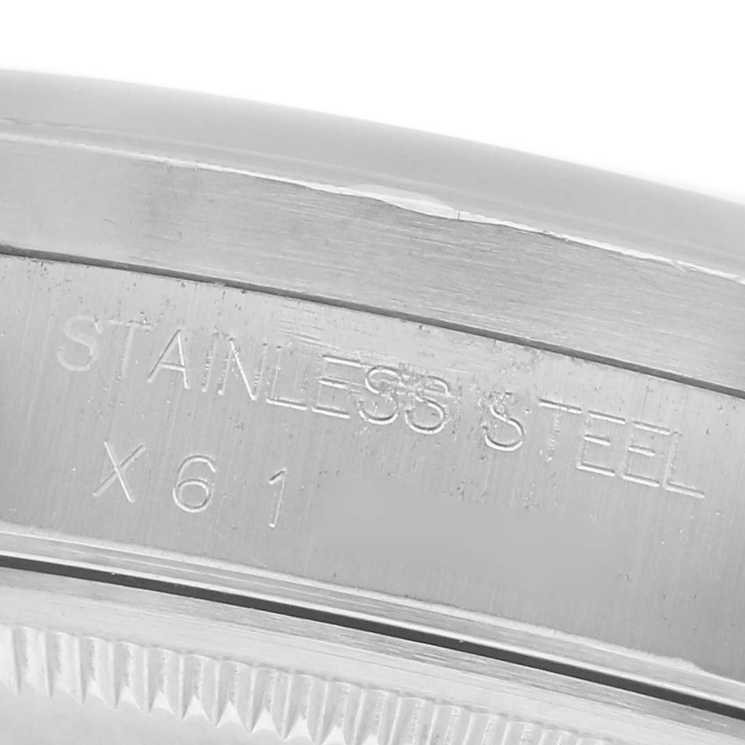 The image shows a close-up of the stainless steel case back of a Rolex Date 15210 Men
s Stainless Steel Silver Dial 15210 Men
s Stainless Steel Silver Dial model, highlighting the engraved text.