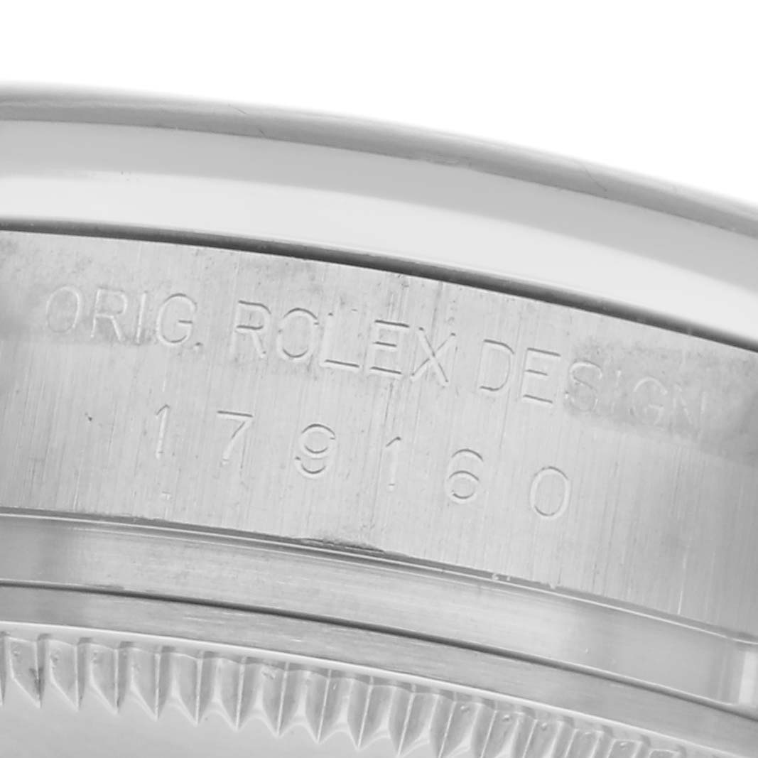 The image shows the side engraving of the Rolex Datejust 179160 Women's Stainless Steel Pink Dial 179160 Women's Stainless Steel Pink Dial, highlighting the model number and design details on the case.