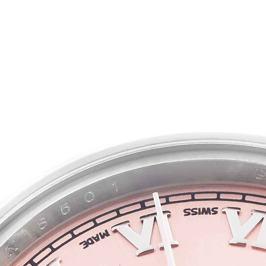 The image shows a close-up of the dial and bezel of a Rolex Datejust 179160 Women's Stainless Steel Pink Dial 179160 Women's Stainless Steel Pink Dial, highlighting the Roman numeral VI and part of the minute hand.