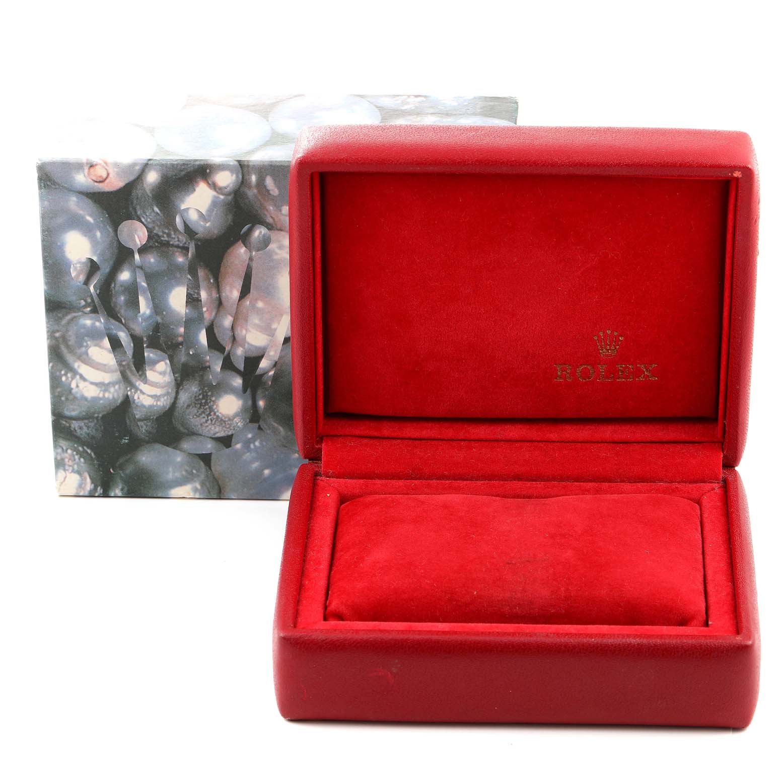 The image shows an open, red Rolex watch box with the logo, designed to hold a Datejust model.