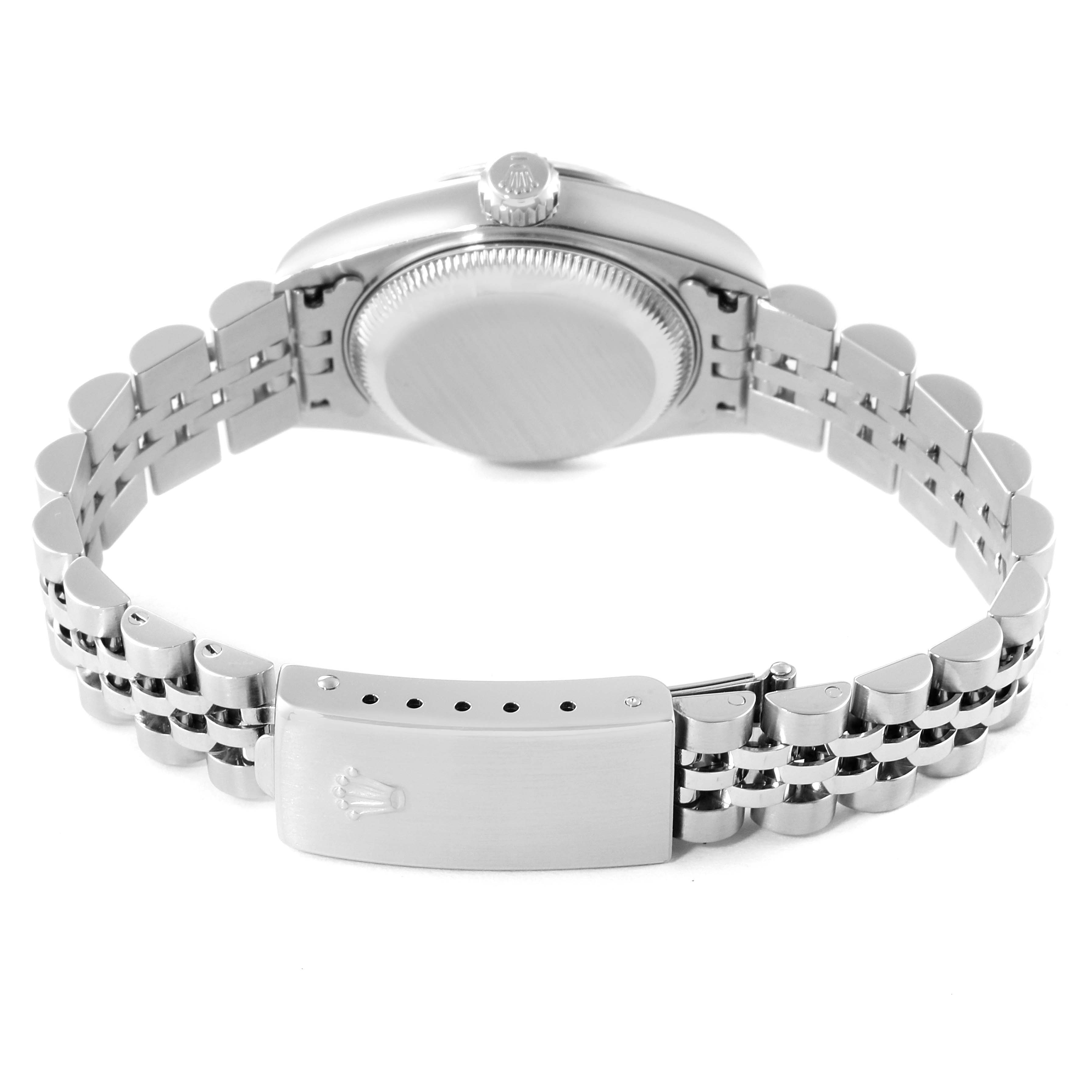 The image shows the back view of a Rolex Datejust 79174 Women
s Stainless Steel Silver Dial 79174 Women
s Stainless Steel Silver Dial watch, focusing on the case back and the metal bracelet with the clasp.