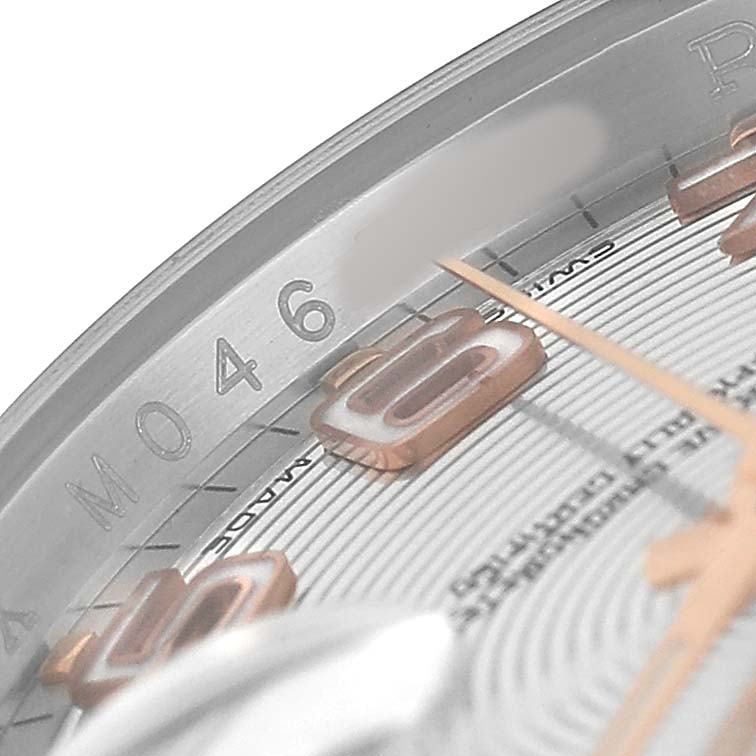 The image shows a close-up of the edge of a Rolex Datejust 116201 Men's Stainless Steel Silver Dial watch dial, focusing on the 5-hour marker with surrounding numerals.