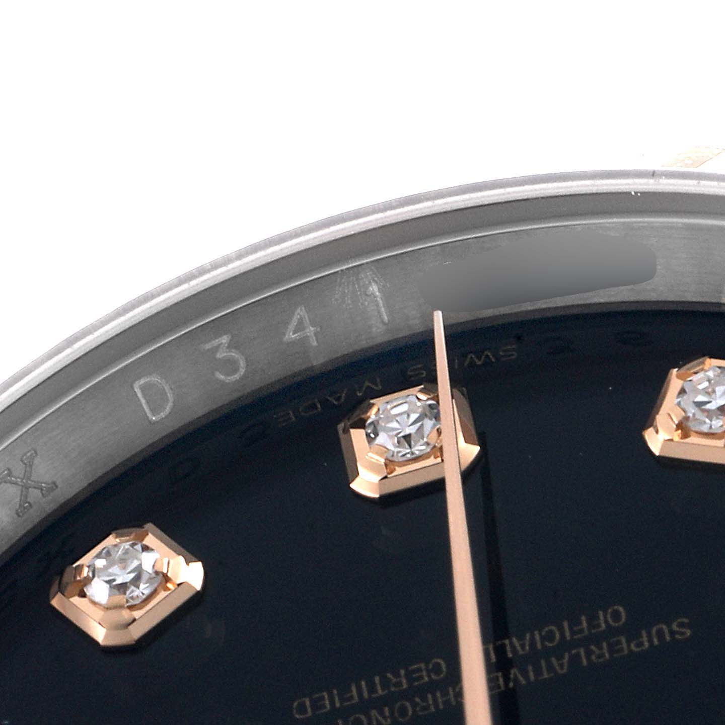 This close-up image shows the dial, hour markers, and part of the bezel of the Rolex Datejust 116231 Men's Steel and Gold (two tone) Black Dial 116231 Men's Steel and Gold (two tone) Black Dial watch.