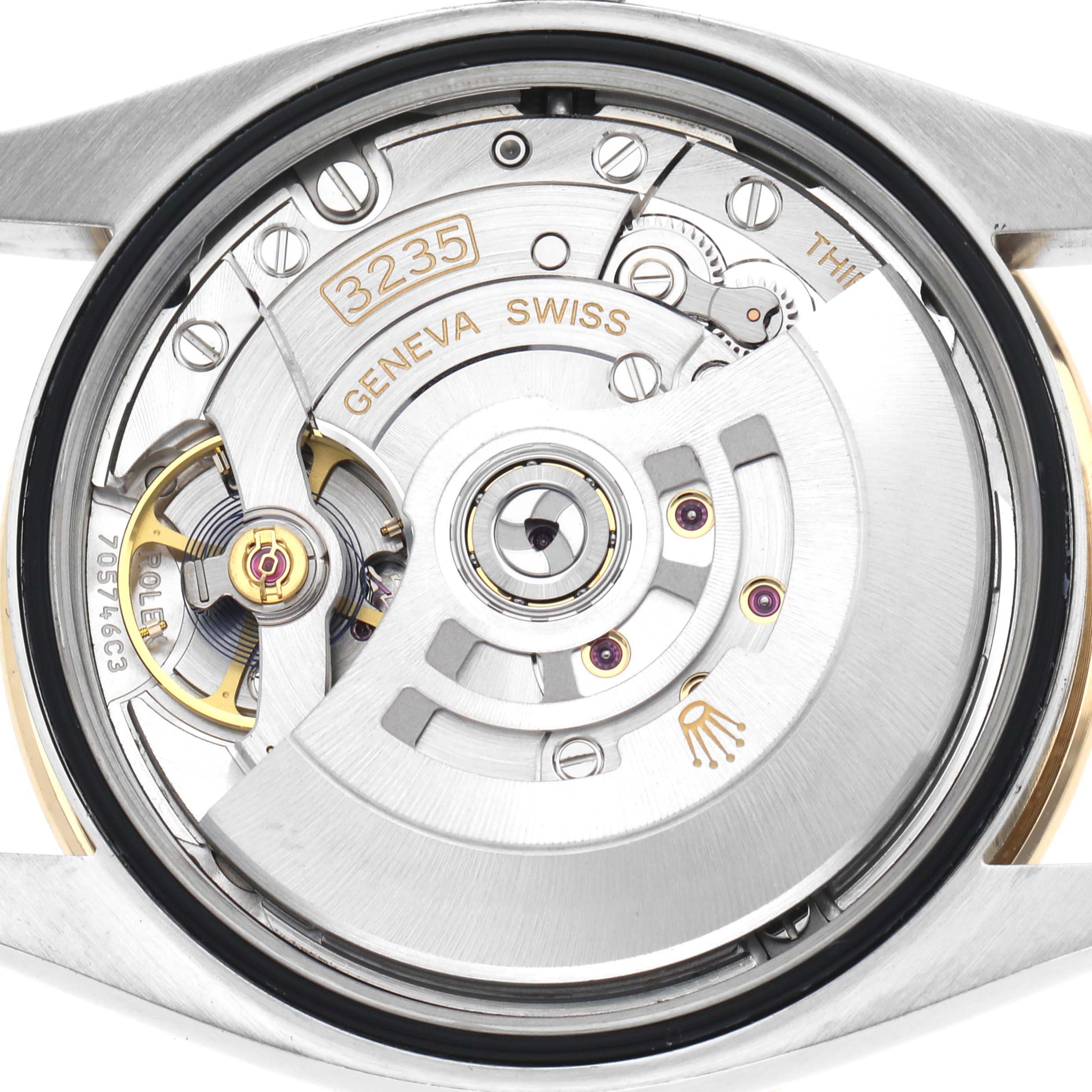The image shows the movement mechanism of a Rolex Datejust 126283 Men
s Steel and Gold (two tone) Silver Dial 126283 Men
s Steel and Gold (two tone) Silver Dial, highlighting the rotor, balance wheel, and engravings from the case back view.