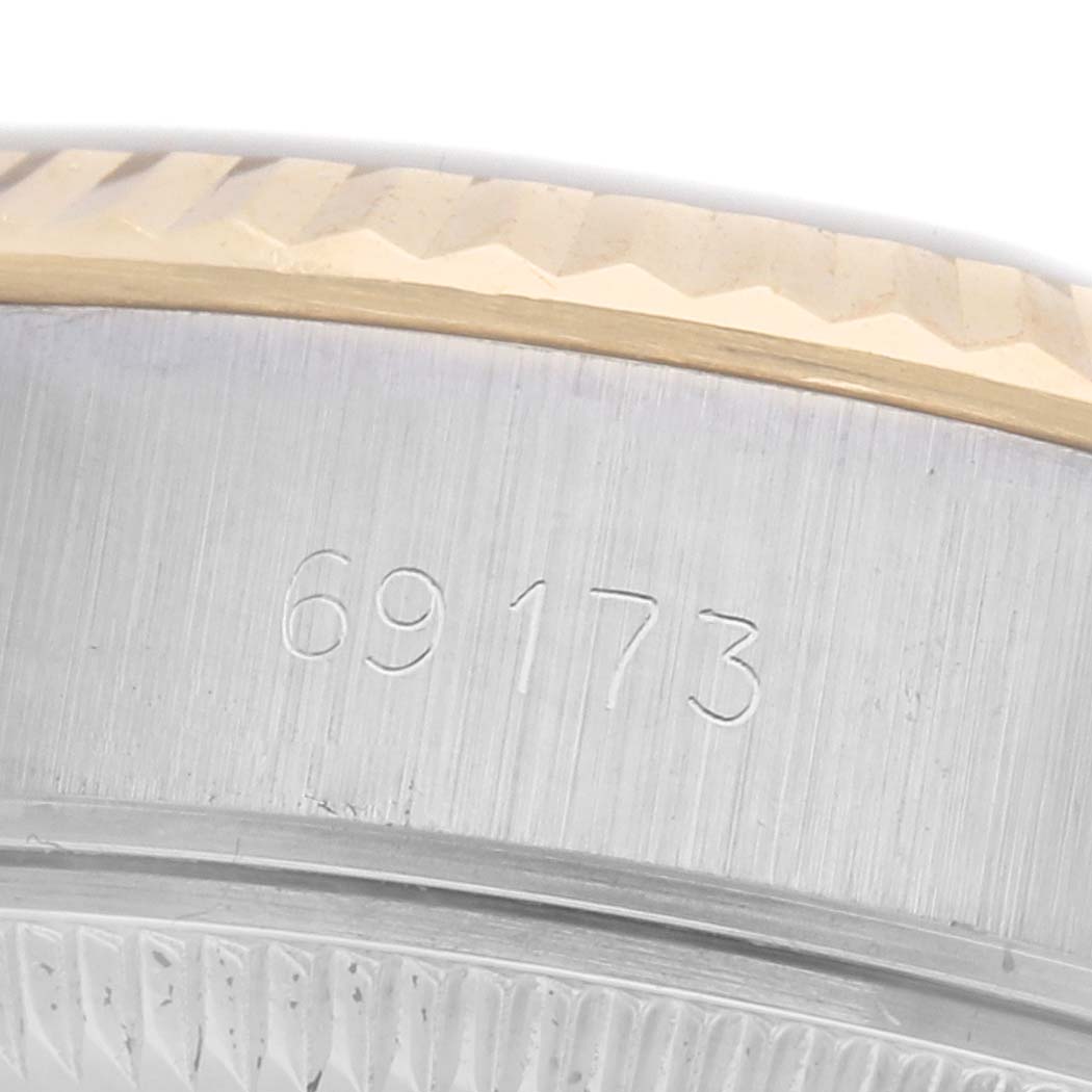 The image shows a close-up of the side and bezel of a Rolex Datejust 69173 Women's Steel and Gold (two tone) Champagne Dial 69173 Women's Steel and Gold (two tone) Champagne Dial, highlighting the model number engraved on the side.