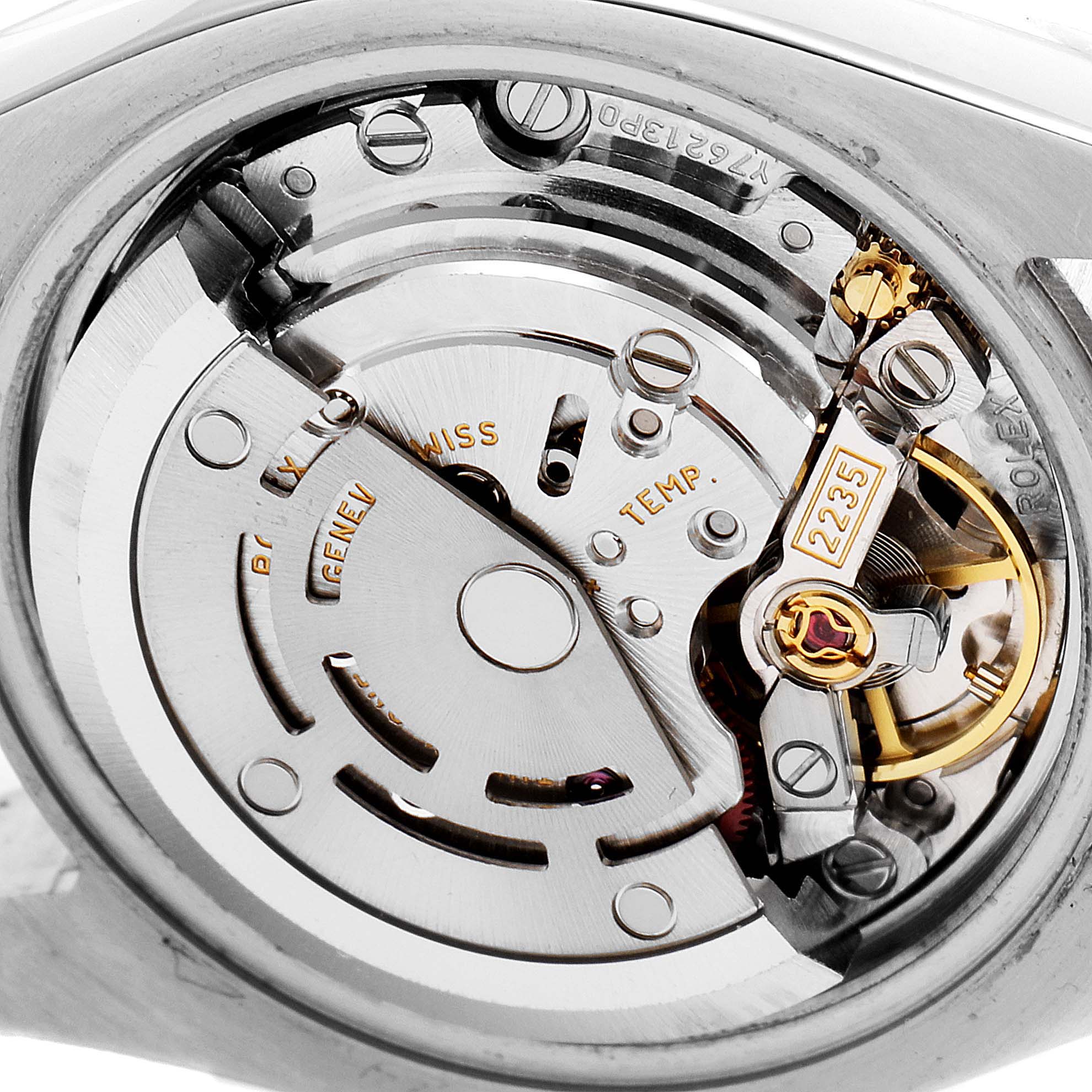 This is a close-up of the Rolex Datejust 179173 Women's Steel and Gold (two tone) Mother of Pearl Dial 179173 Women's Steel and Gold (two tone) Mother of Pearl Dial model, showcasing its intricate internal movement and components.