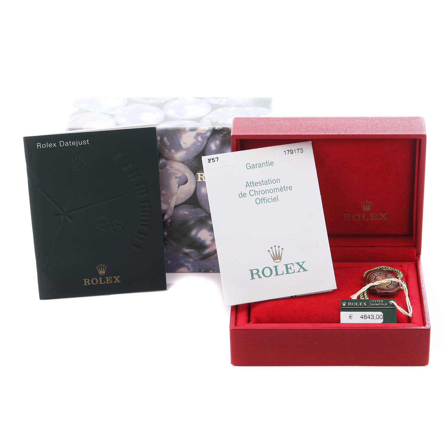 The image shows Rolex Datejust 179173 Women's Steel and Gold (two tone) White Dial 179173 Women's Steel and Gold (two tone) White Dial accessories: a box, warranty card, manual, and tags, viewed from an overhead angle.