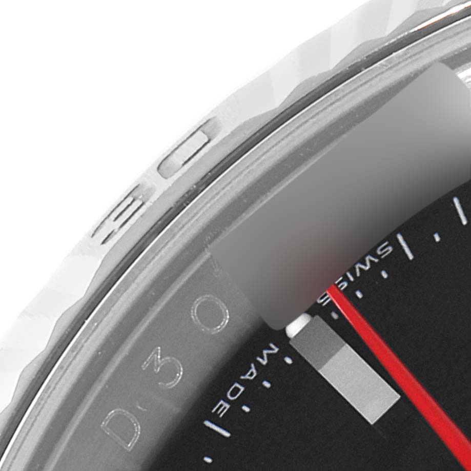 This close-up image of a Rolex Turn-o-Graph 116264 Men's Stainless Steel Black Dial 116264 Men's Stainless Steel Black Dial watch shows part of the bezel and dial, featuring the "SWISS MADE" text and red hand.