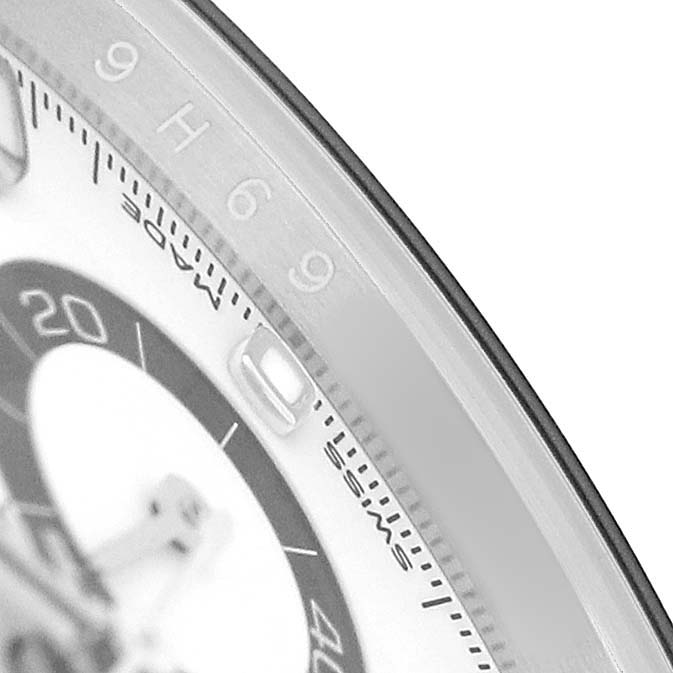 The image shows a close-up of the bezel and partial dial of a Rolex Daytona M116500LN-0001 Men's Stainless Steel White Dial, highlighting the tachymetric scale.