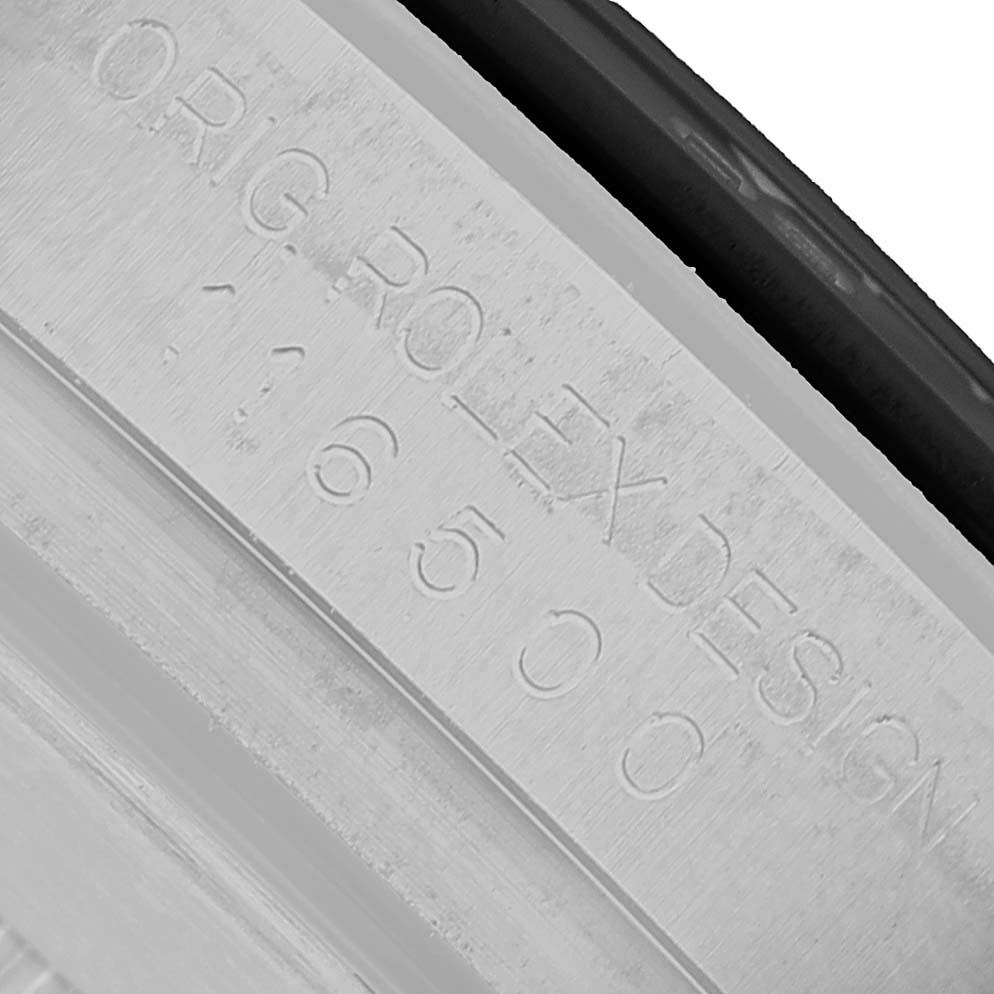 The image shows the engraving on the edge of the caseback of a Rolex Daytona M116500LN-0001 Men's Stainless Steel White Dial watch.