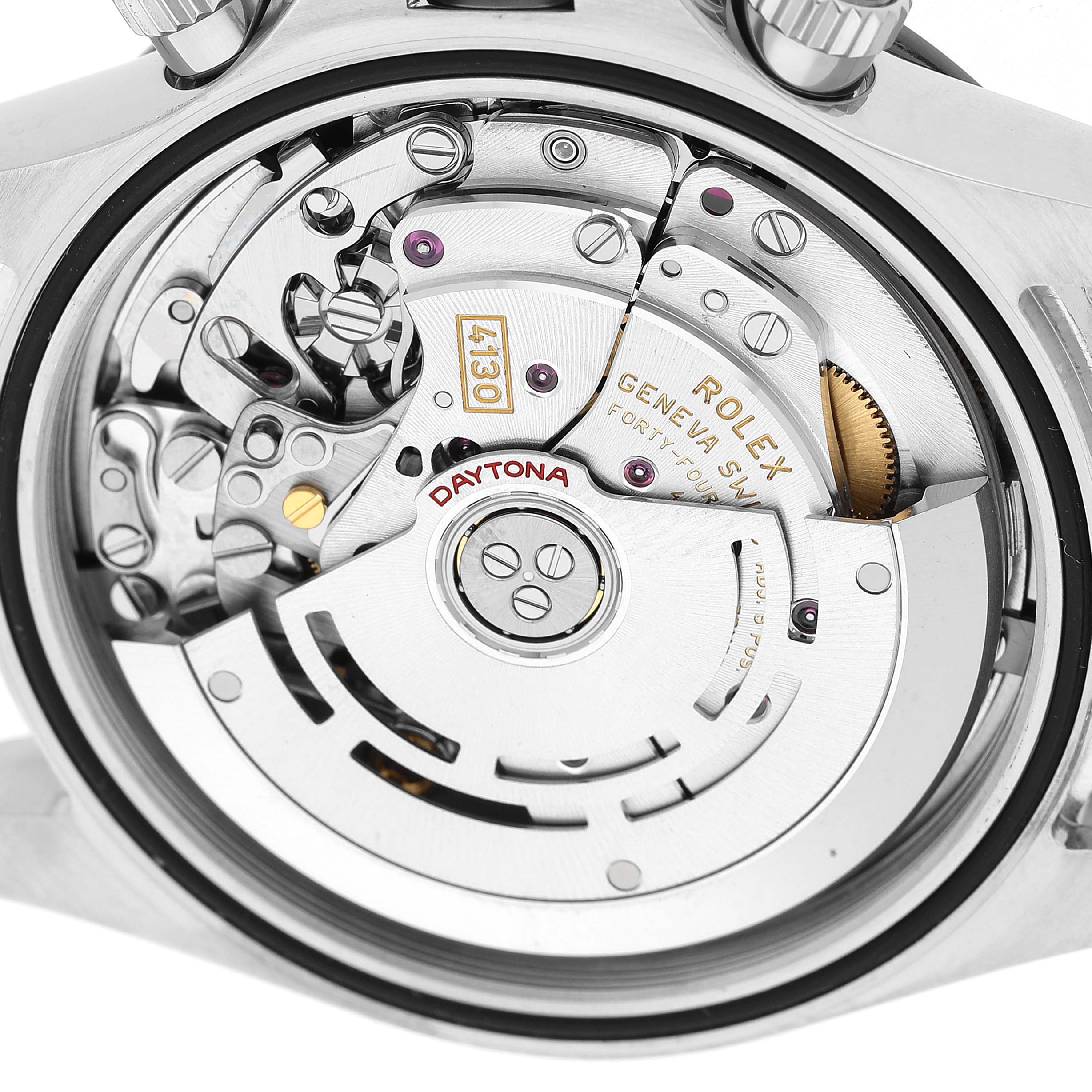 The image shows the movement of a Rolex Daytona M116500LN-0001 Men's Stainless Steel White Dial watch from a rear angle, highlighting its intricate mechanical components.