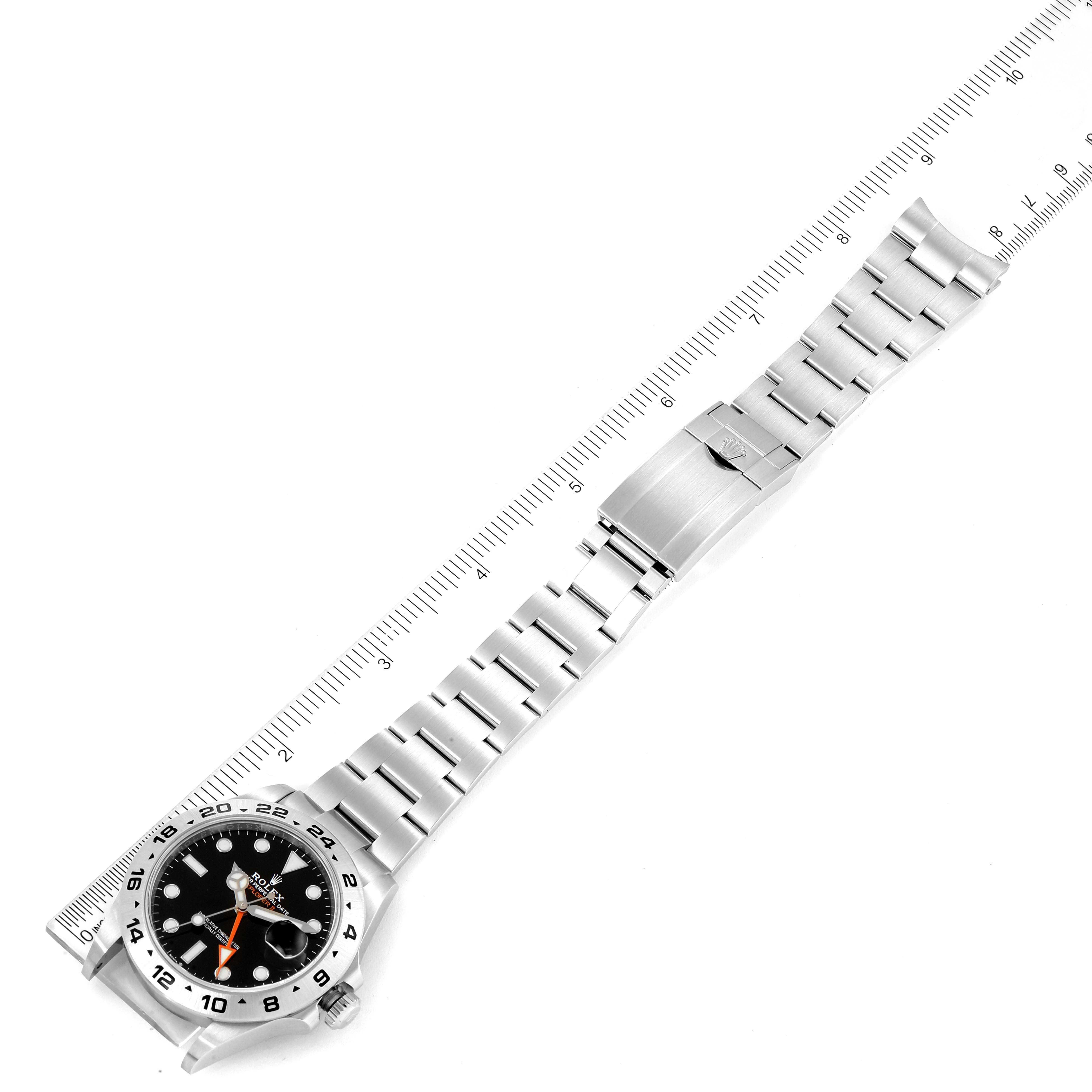 The image shows a top-down view of a Rolex Explorer 226570 Men
s Stainless Steel Black Dial 226570 Men
s Stainless Steel Black Dial watch, highlighting the bracelet, clasp, and dial.