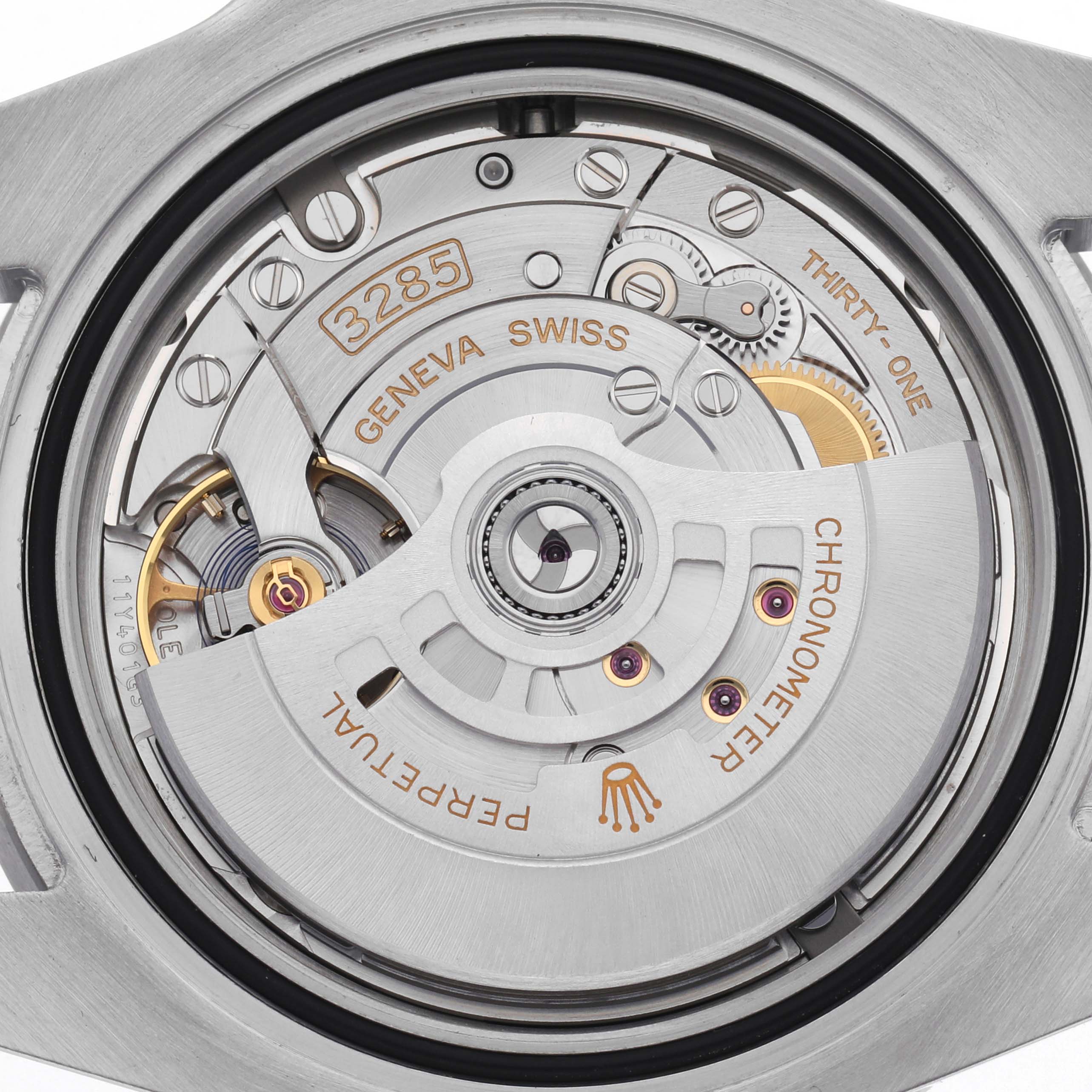 The image shows the movement mechanism of a Rolex GMT-Master 126710GRNR Men
s Stainless Steel Black Dial 126710GRNR Men
s Stainless Steel Black Dial watch from a rear angle, highlighting the rotor and inner components.