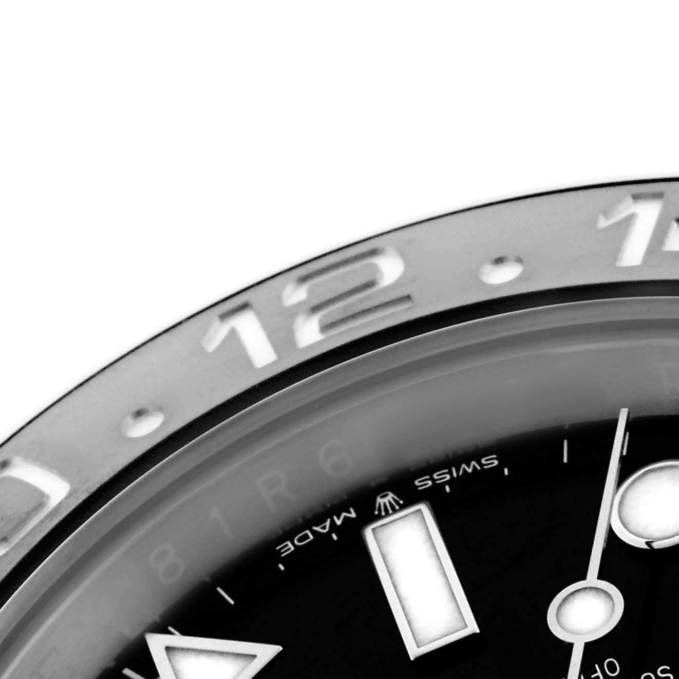 The image shows a close-up of the Rolex GMT-Master 126710GRNR Men
s Stainless Steel Black Dial 126710GRNR Men
s Stainless Steel Black Dial
s bezel and part of the dial, highlighting indices and markers.