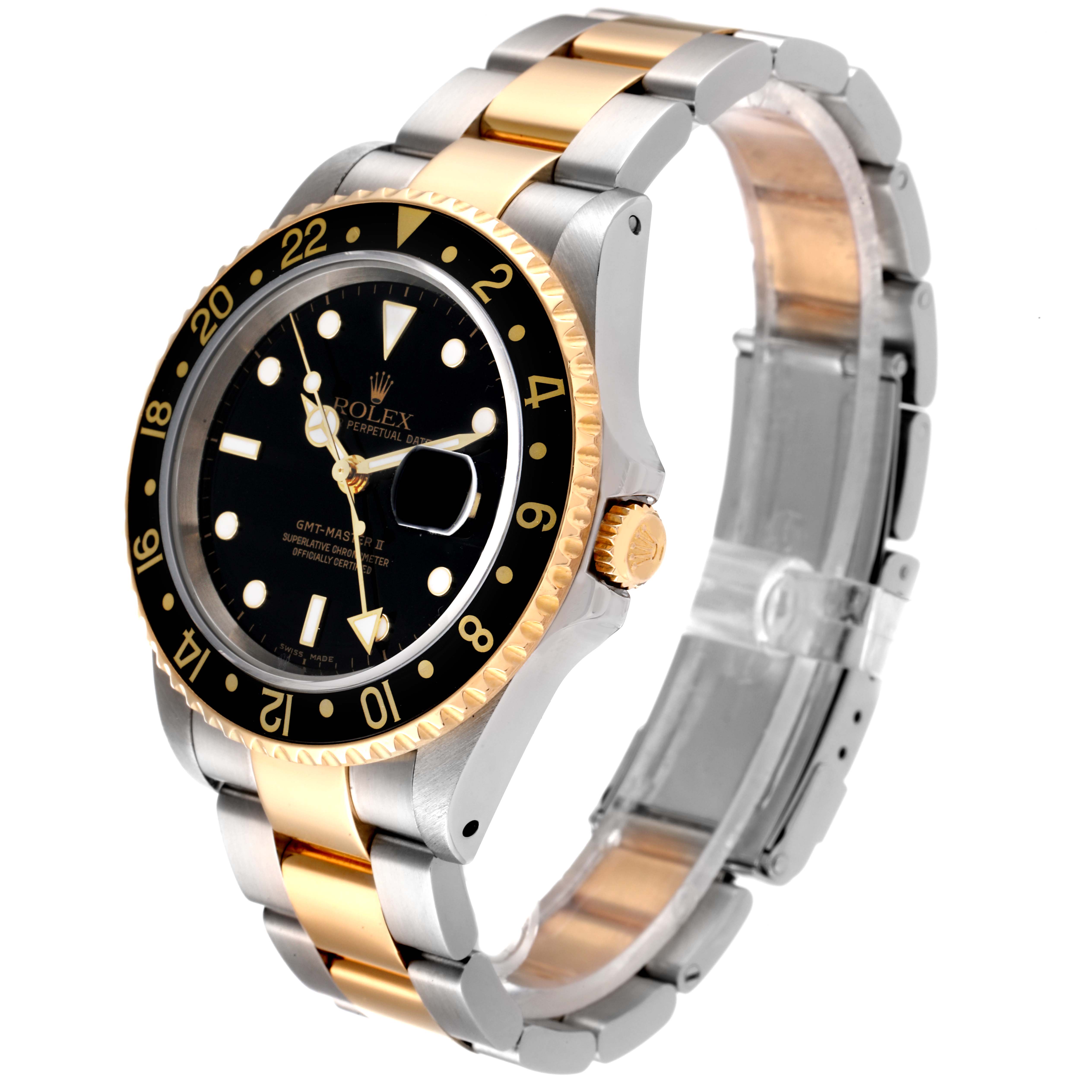 This image shows a side-front angle of a Rolex GMT-Master 16713 Men's Steel and Gold (two tone) Black Dial 16713 Men's Steel and Gold (two tone) Black Dial watch, highlighting its two-tone band, black bezel, and dial.