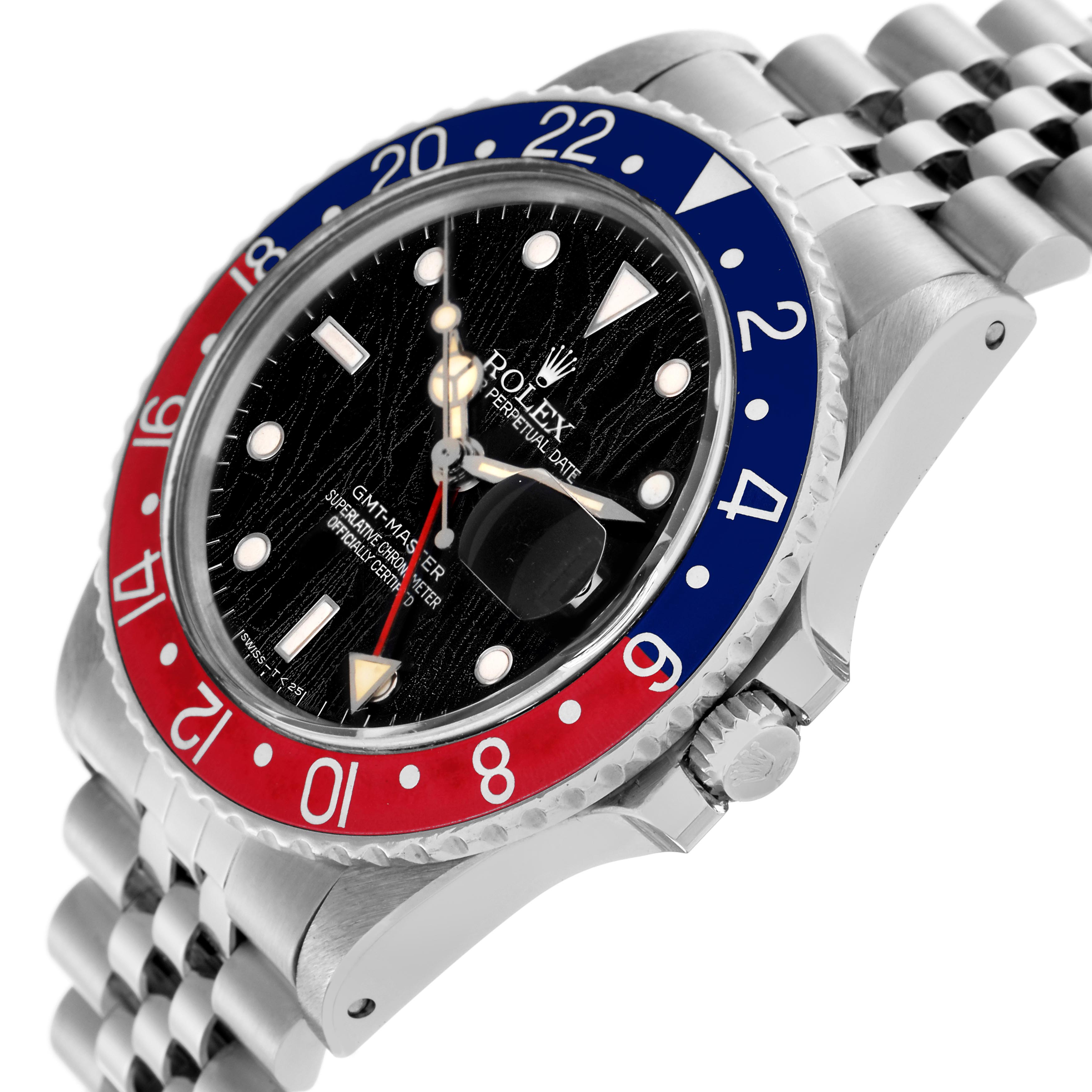 The Rolex GMT-Master 16750 Men
s Stainless Steel Black Dial 16750 Men
s Stainless Steel Black Dial watch is shown at an angled side view, highlighting its bezel, dial, crown, and Jubilee bracelet.