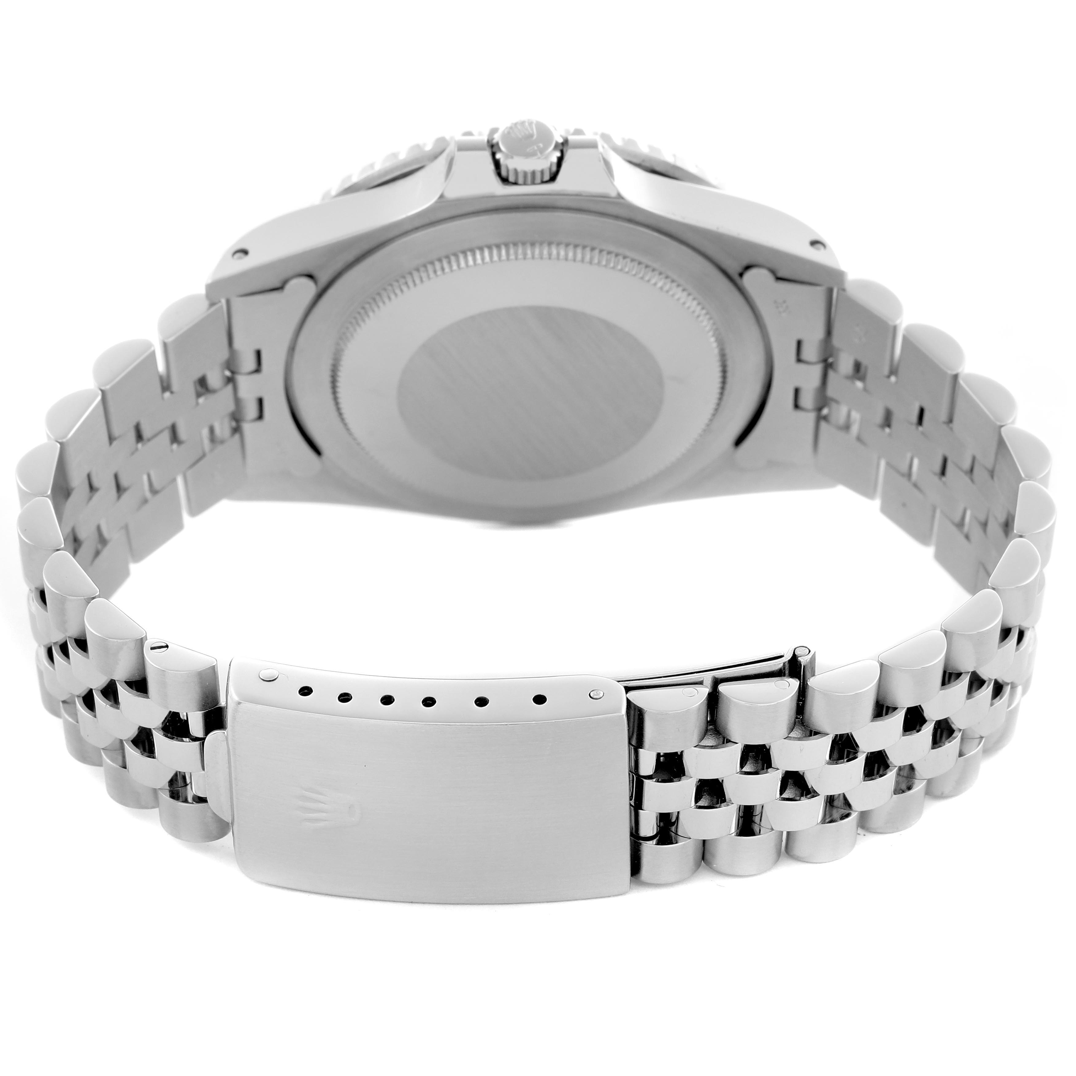 The image shows the back view of a Rolex GMT-Master 16750 Men
s Stainless Steel Black Dial 16750 Men
s Stainless Steel Black Dial, highlighting the case back, crown, and bracelet clasp.