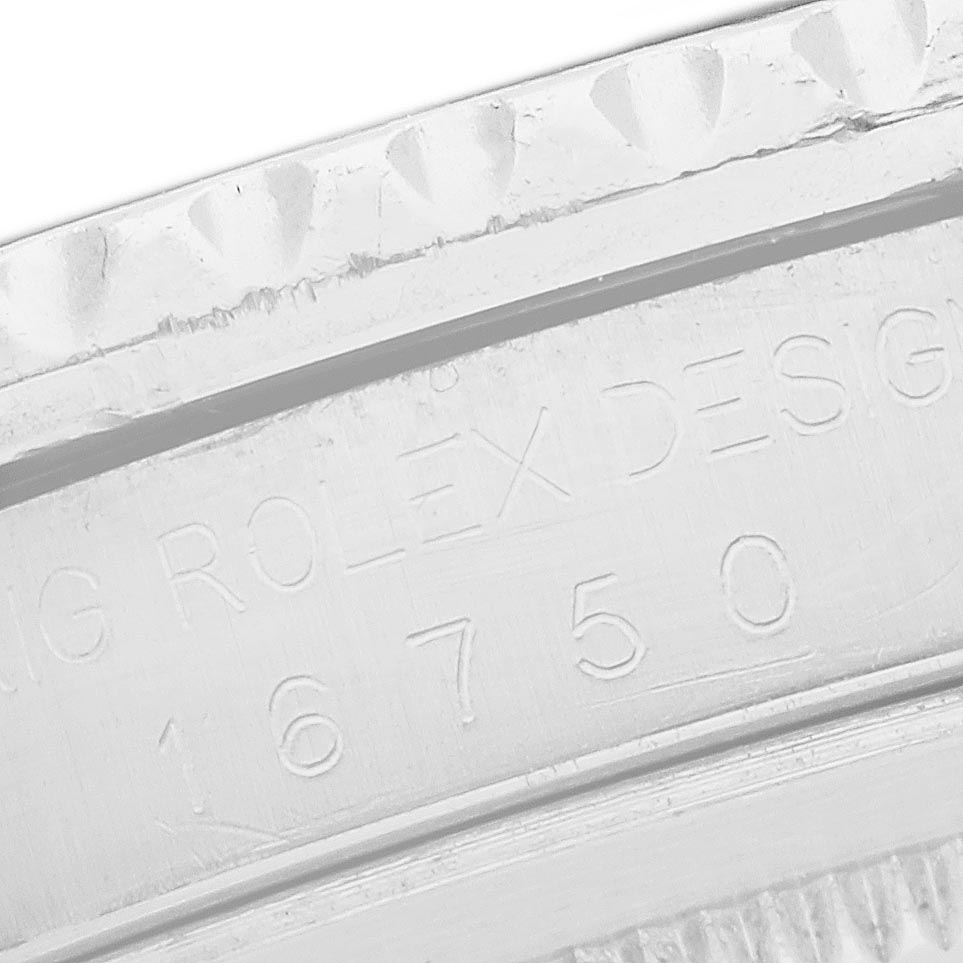 This close-up image of the Rolex GMT-Master 16750 Men
s Stainless Steel Black Dial 16750 Men
s Stainless Steel Black Dial shows the engraved serial number and part of the bezel.