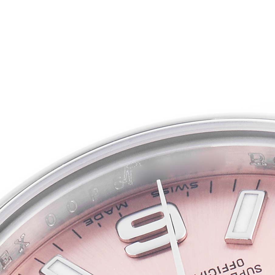 The image shows a partial view of a Rolex Oyster Perpetual 176200 Women's Stainless Steel Pink Dial 176200 Women's Stainless Steel Pink Dial watch, focusing on the upper part of the dial and casing.