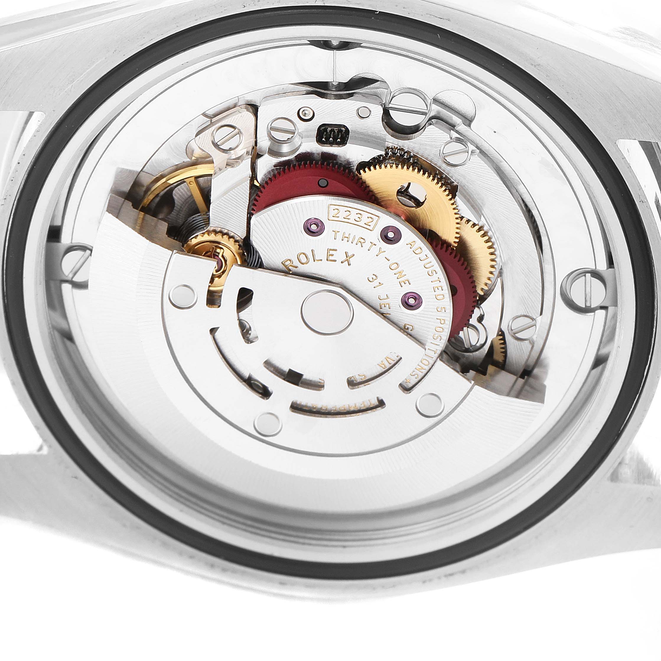 This image shows the internal movement mechanisms of a Rolex Oyster Perpetual 124200 Men's Stainless Steel Silver Dial 124200 Men's Stainless Steel Silver Dial watch from a rear angle.