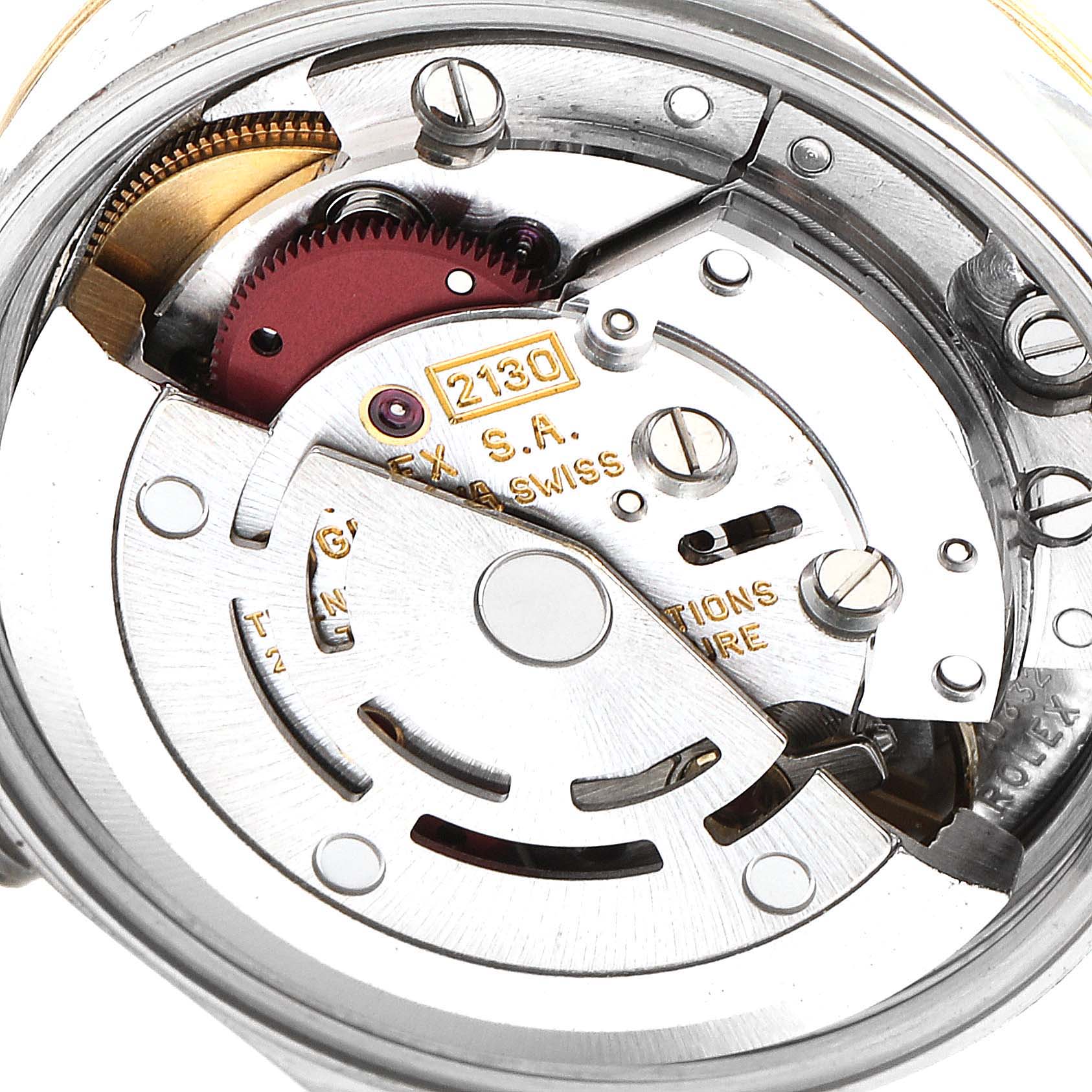 The image shows the internal mechanical movement of a Rolex Oyster Perpetual 67193 Women
s Steel and Gold (two tone) Champagne Dial 67193 Women
s Steel and Gold (two tone) Champagne Dial watch, featuring the intricate components and engravings.