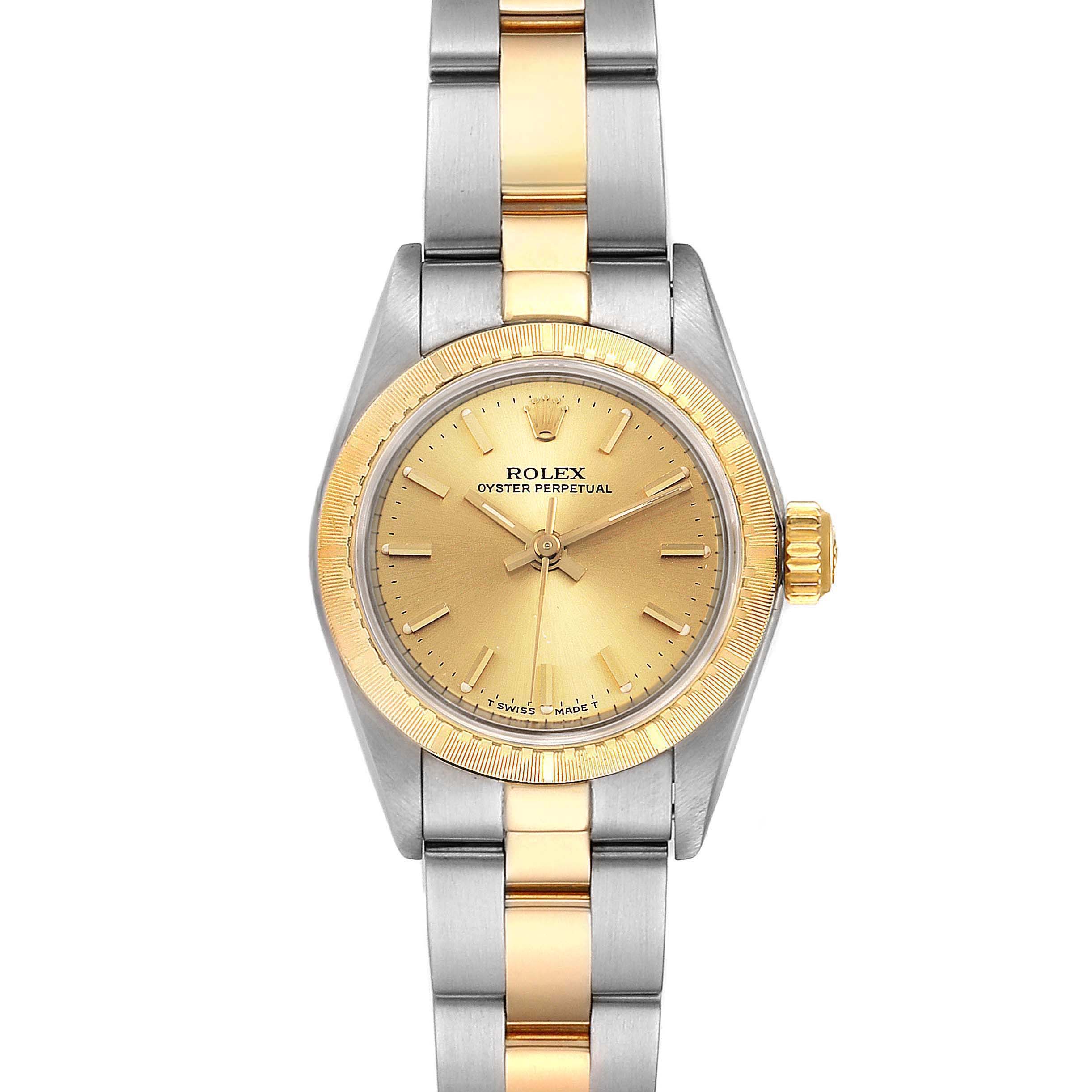 The Rolex Oyster Perpetual 67243 Women
s Steel and Gold (two tone) Champagne Dial 67243 Women
s Steel and Gold (two tone) Champagne Dial watch shown is at a front angle, displaying its dial, case, crown, and two-tone bracelet.