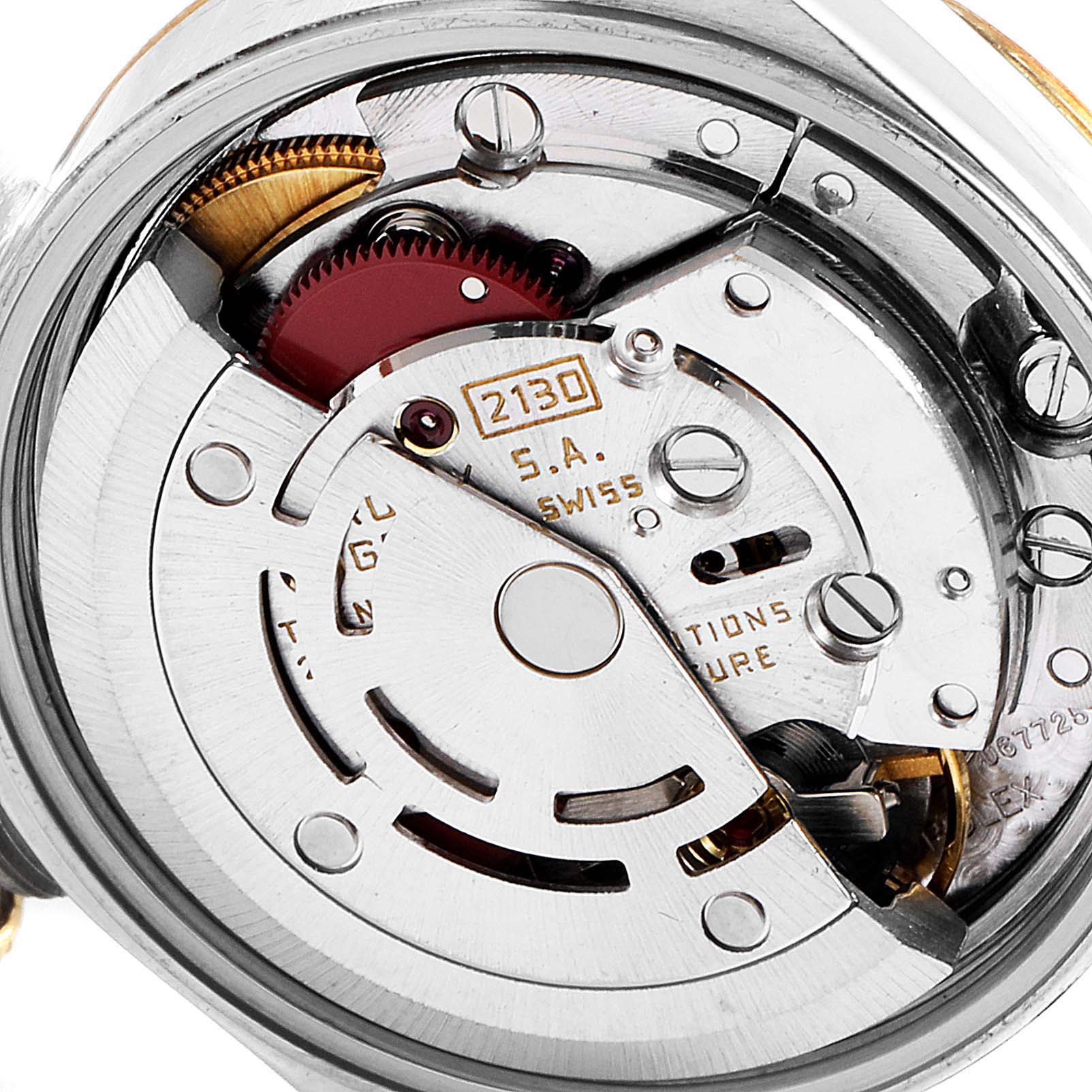 This image shows the internal mechanism of a Rolex Oyster Perpetual 67243 Women
s Steel and Gold (two tone) Champagne Dial 67243 Women
s Steel and Gold (two tone) Champagne Dial watch, highlighting the movement components from the back.